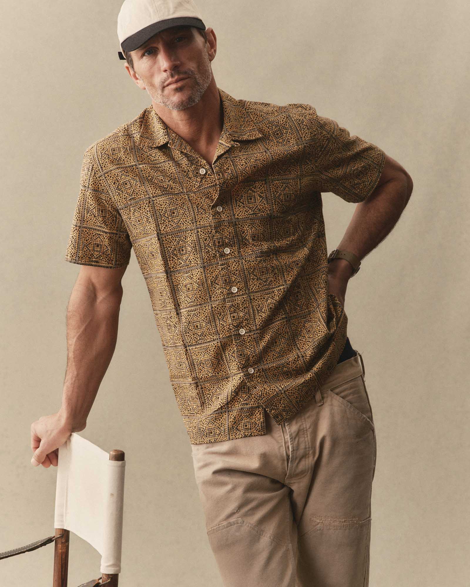 fit model leaning against a chair wearing The Hawthorne Shirt in Fennel Block Print, Wovens by Taylor Stitch