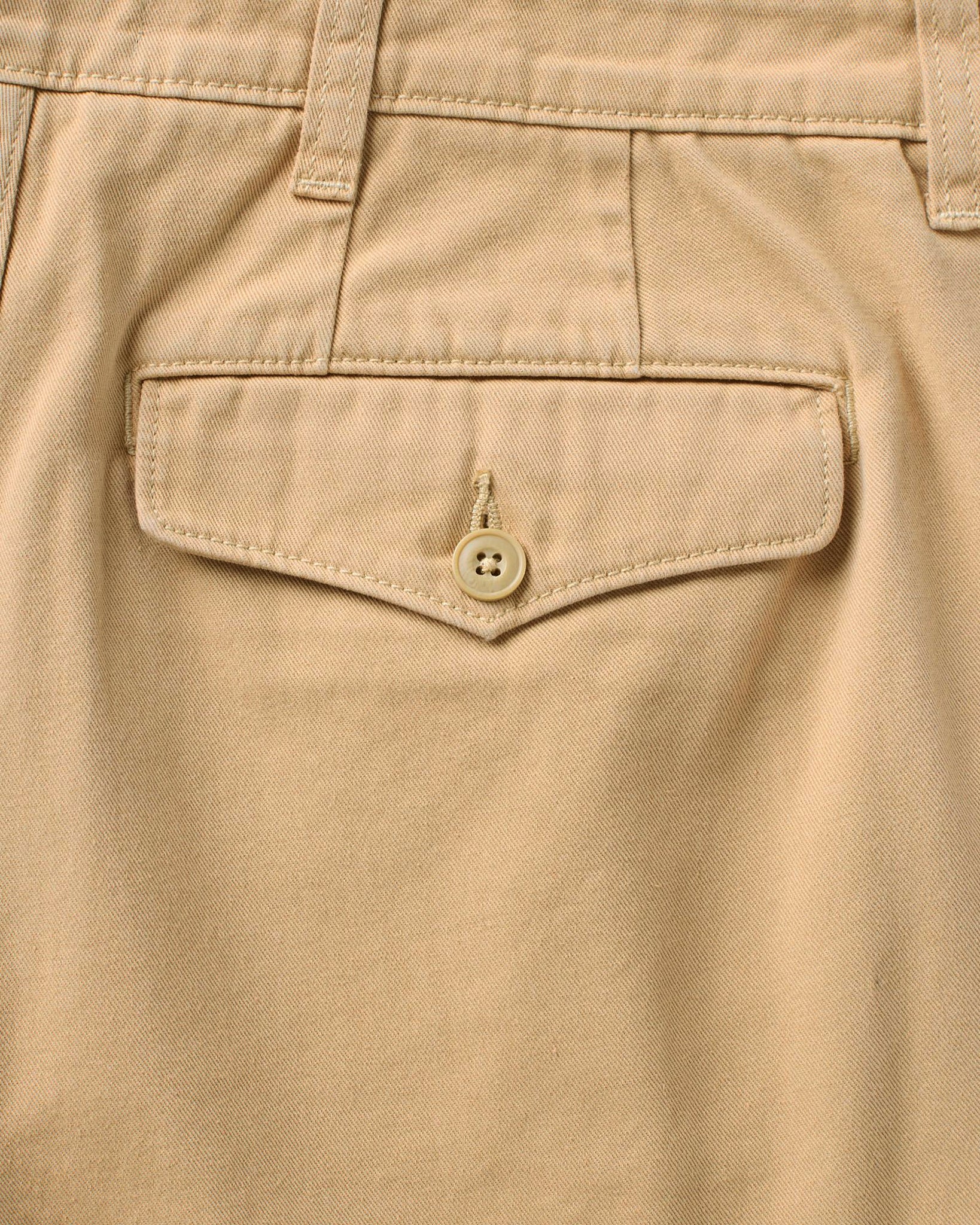 material shot of the back pocket on The Pleated Short in Organic Field Khaki Twill, Bottoms by Taylor Stitch