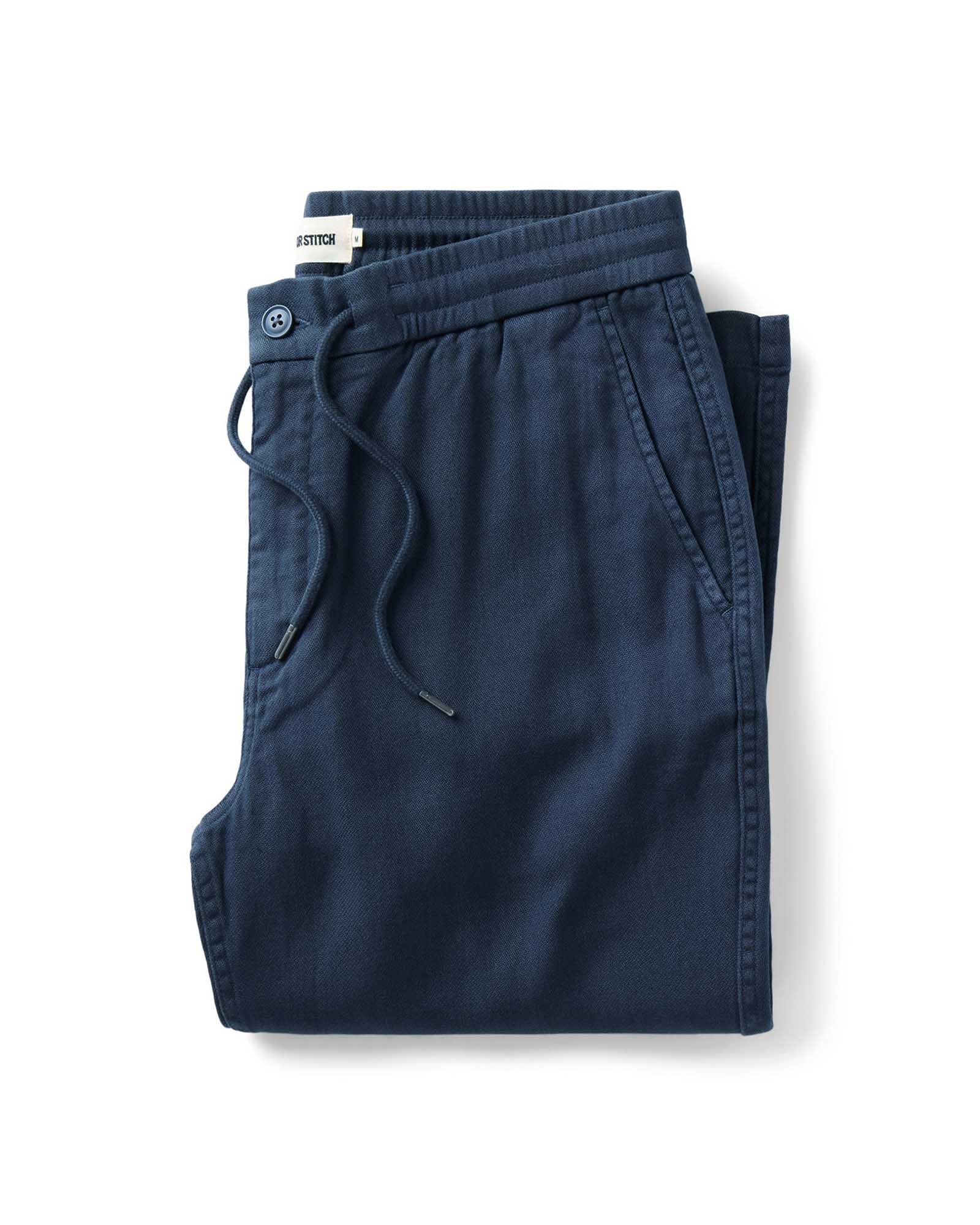 folded flatlay of The Roamer Pant in Navy Broken Twill, Bottoms by Taylor Stitch