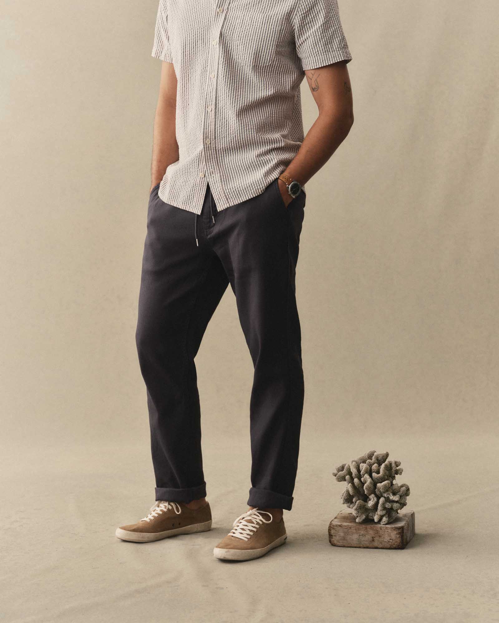 fit model posing in The Roamer Pant in Navy Broken Twill, Bottoms by Taylor Stitch