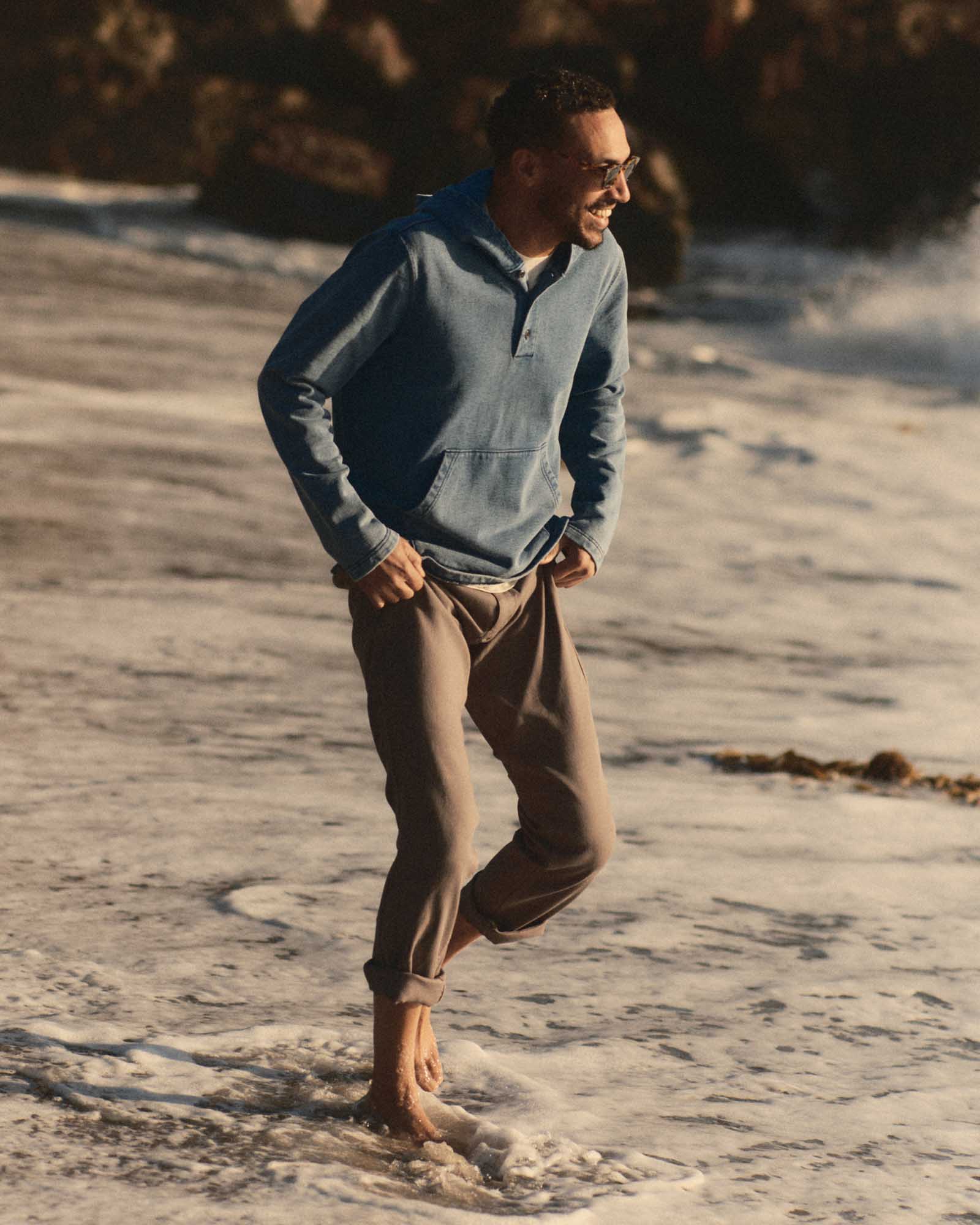 fit model walking wearing The Roamer Pant in Smoked Olive Broken Twill, Bottoms by Taylor Stitch