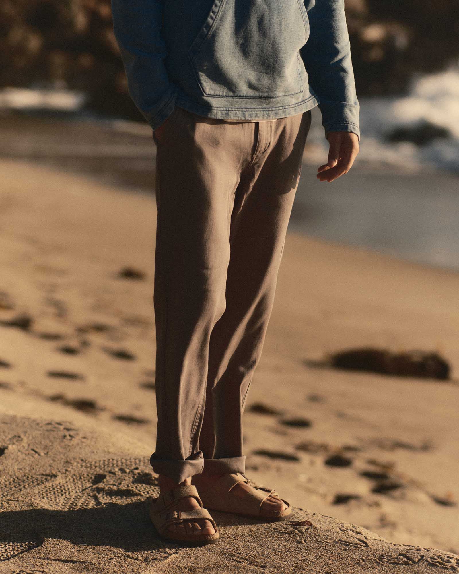 fit model posing in The Roamer Pant in Smoked Olive Broken Twill, Bottoms by Taylor Stitch