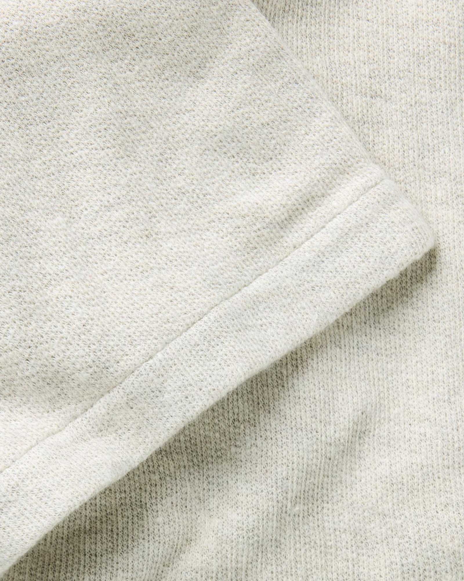 material shot of the sleeve on The Short Sleeve California in Heather Oat Double Knit, Knits by Taylor Stitch