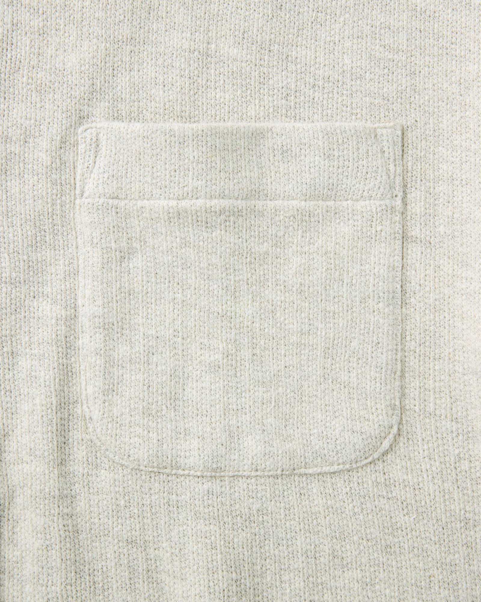 material shot of the pocket on The Short Sleeve California in Heather Oat Double Knit, Knits by Taylor Stitch