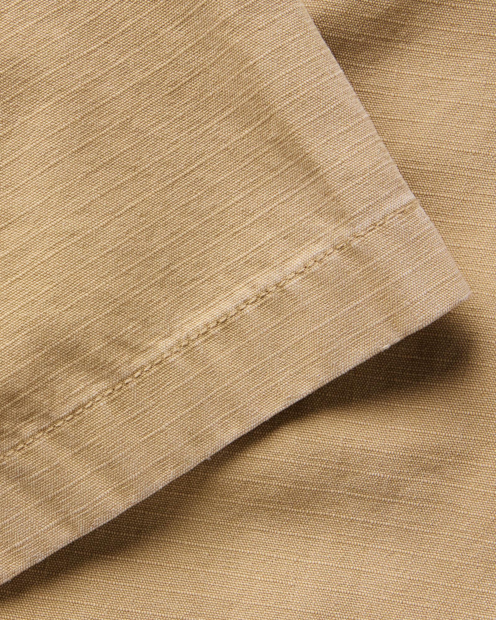 material shot of the sleeve on The Short Sleeve Mechanic Shirt in Khaki Ripstop, Wovens by Taylor Stitch