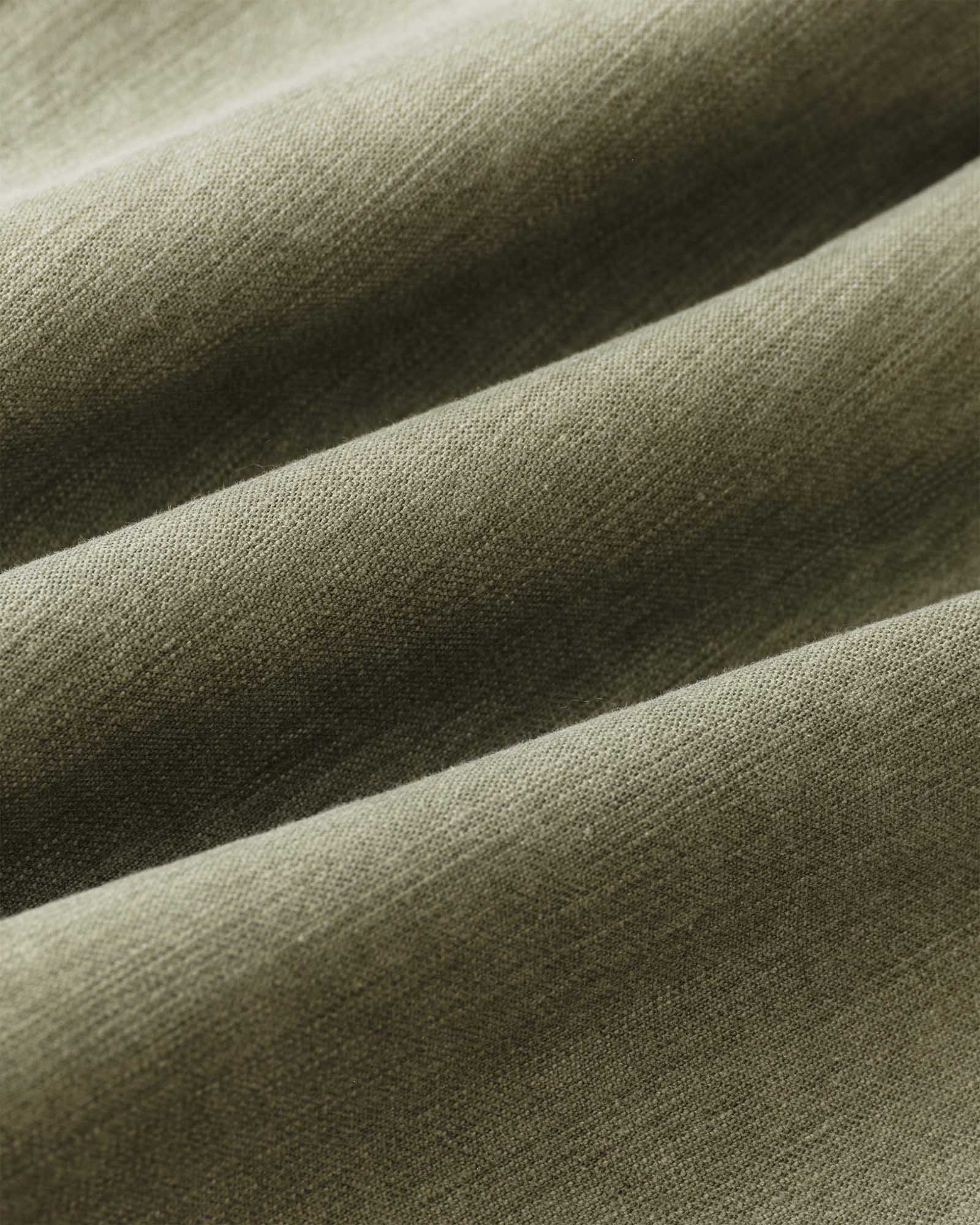 material shot of the fabric on The Surplus Shirt in Field Olive Reverse Sateen, Wovens by Taylor Stitch