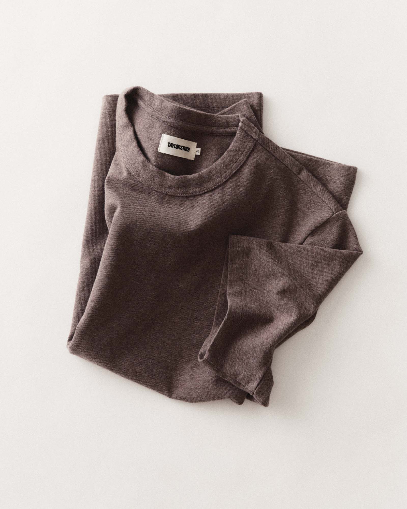editorial flatlay of The Organic Cotton Shop Tee in Plum Twist, Knits by Taylor Stitch