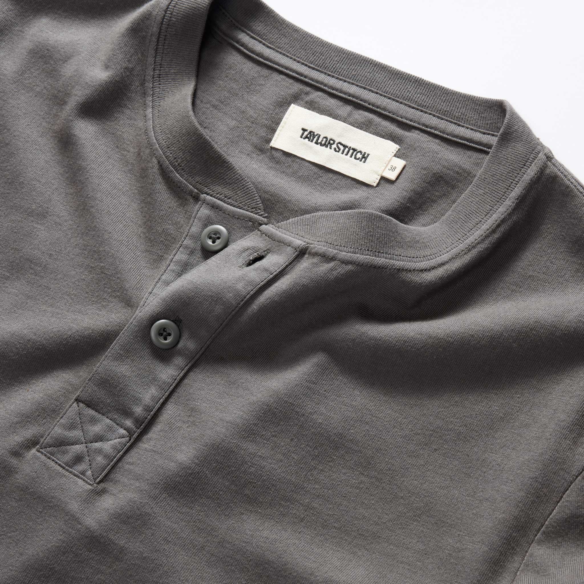 material shot of the collar on The Organic Cotton Henley in Faded Black, Knits by Taylor Stitch