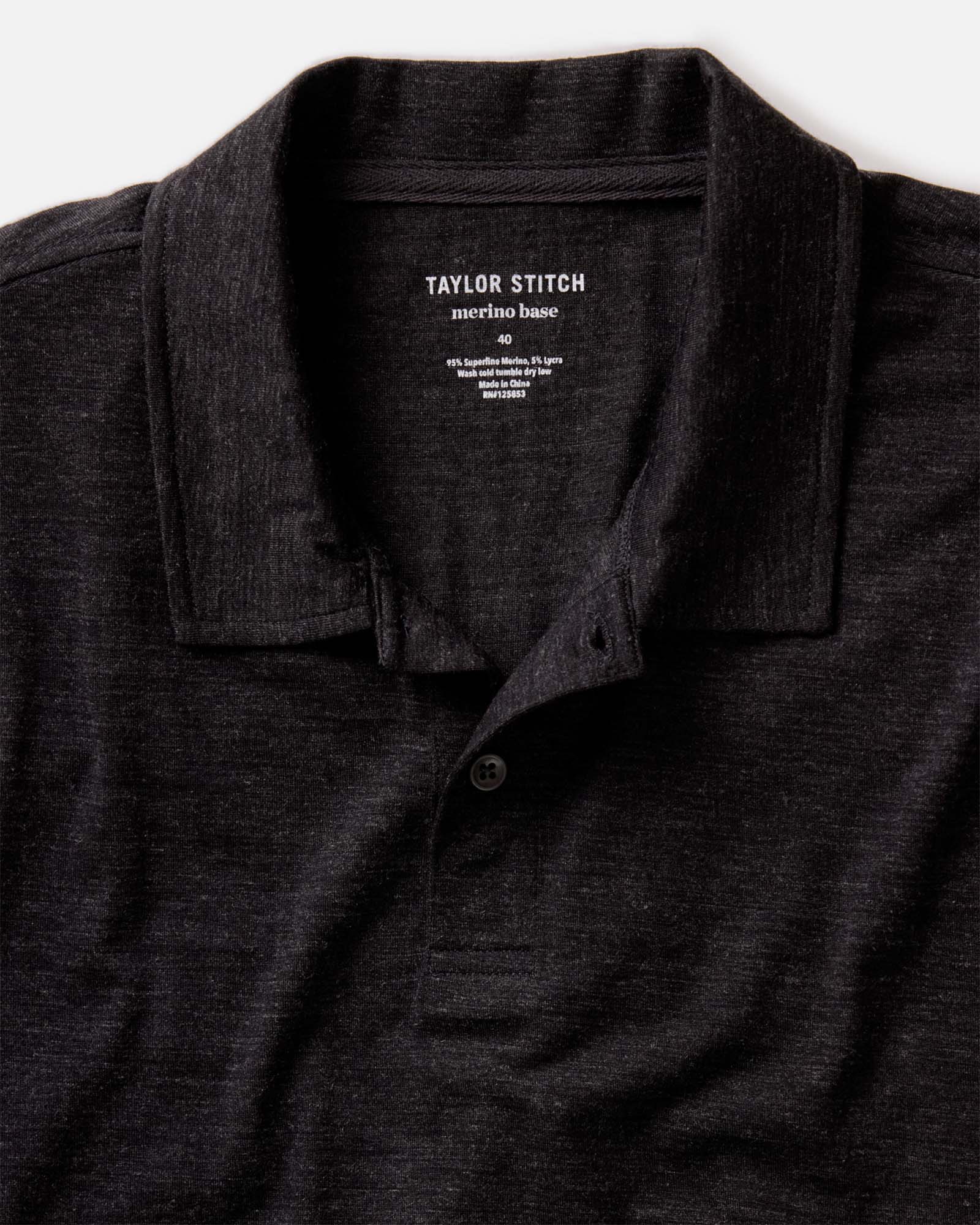 fit model showing off The Merino Polo in Heather Black, Knits by Taylor Stitch