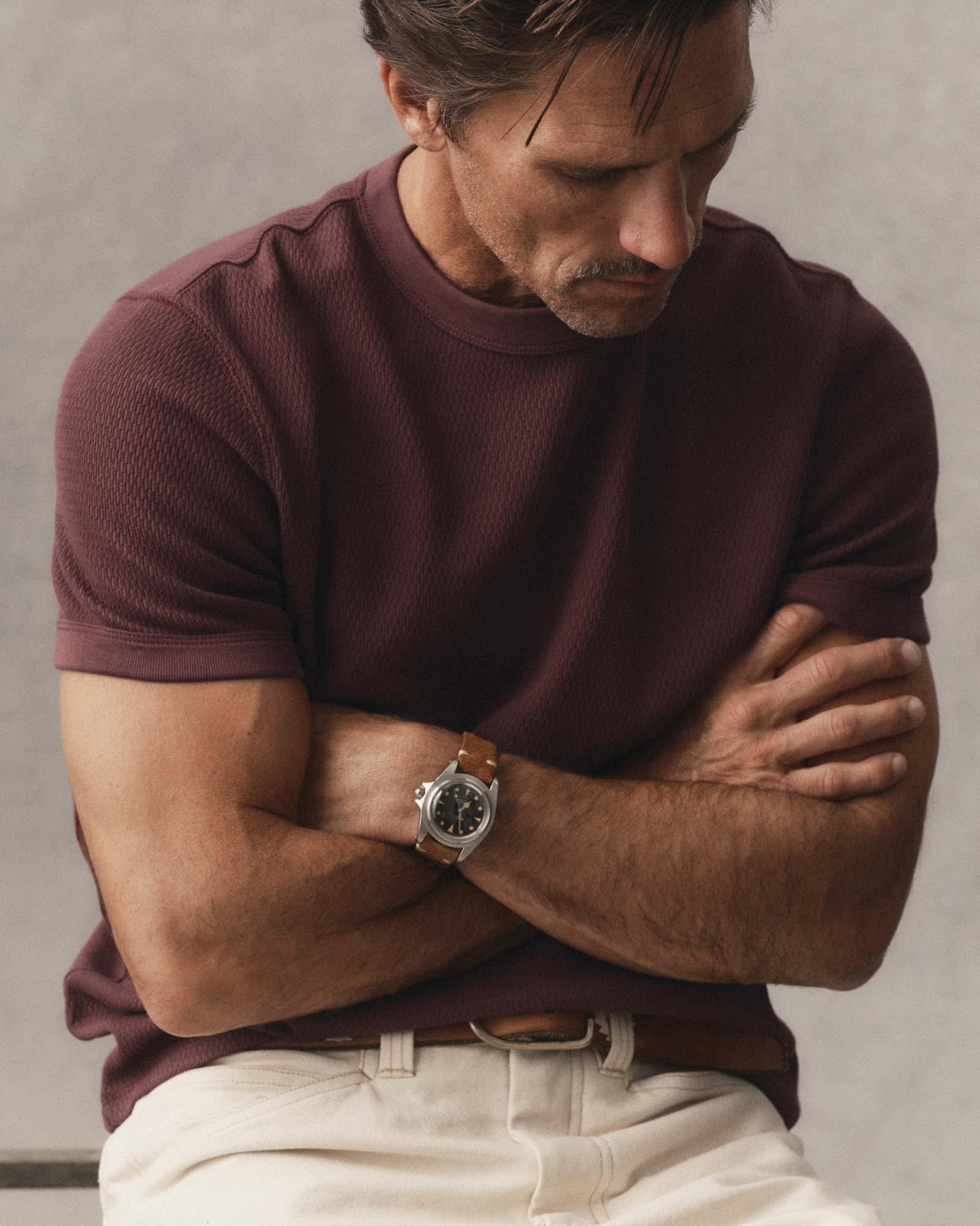 fit model posing in The Organic Cotton Short Sleeve Crew in Burgundy Waffle, Knits by Taylor Stitch