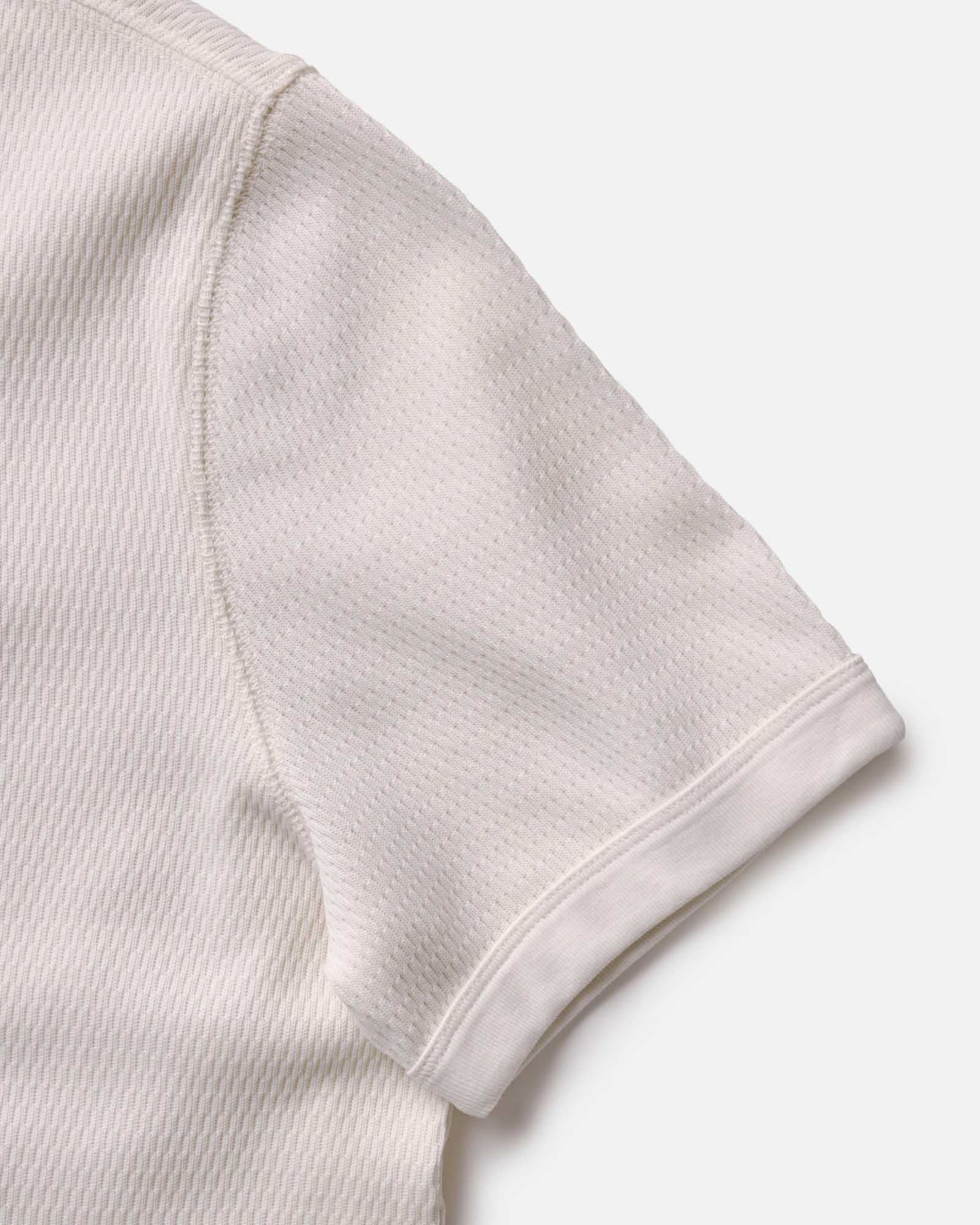 material shot of the sleeves on The Organic Cotton Short Sleeve Crew in Vintage White Waffle, Knits by Taylor Stitch
