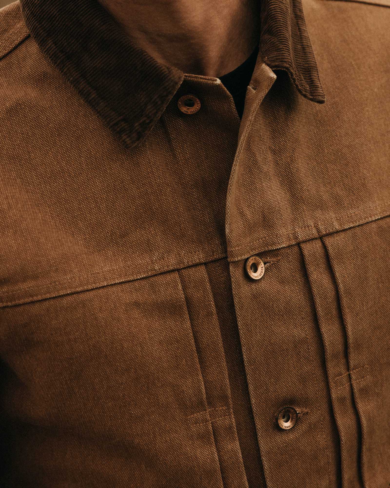 fit model adjusting the collar on The Ryder Jacket in Tobacco Chipped Canvas, Outerwear by Taylor Stitch