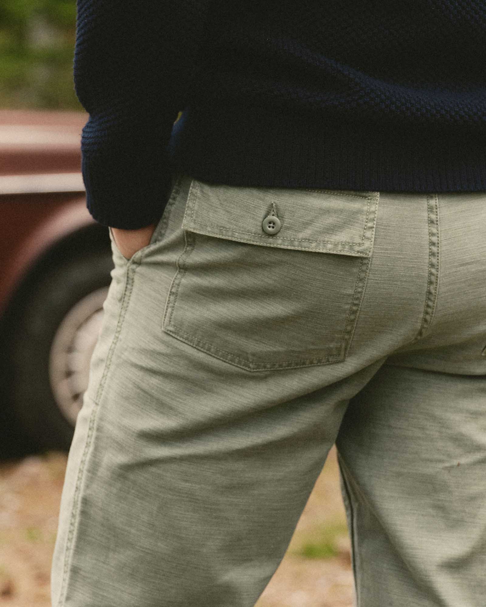 fit model walking on The Surplus Pant in Field Olive Reverse Sateen, Bottoms by Taylor Stitch