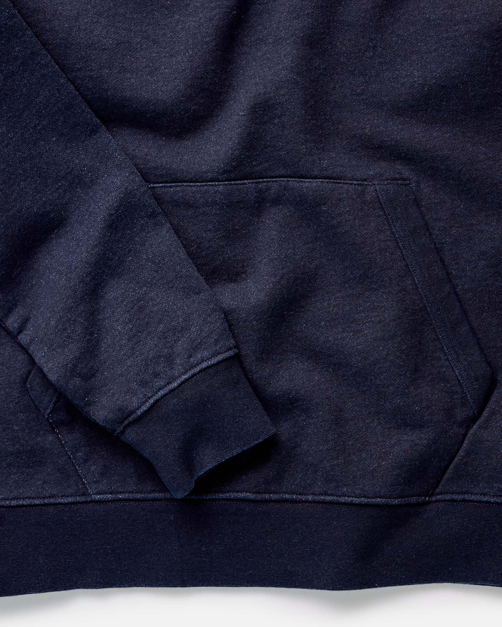fit model with the hood up in The Apres Hoodie in Indigo Terry, Knits by Taylor Stitch