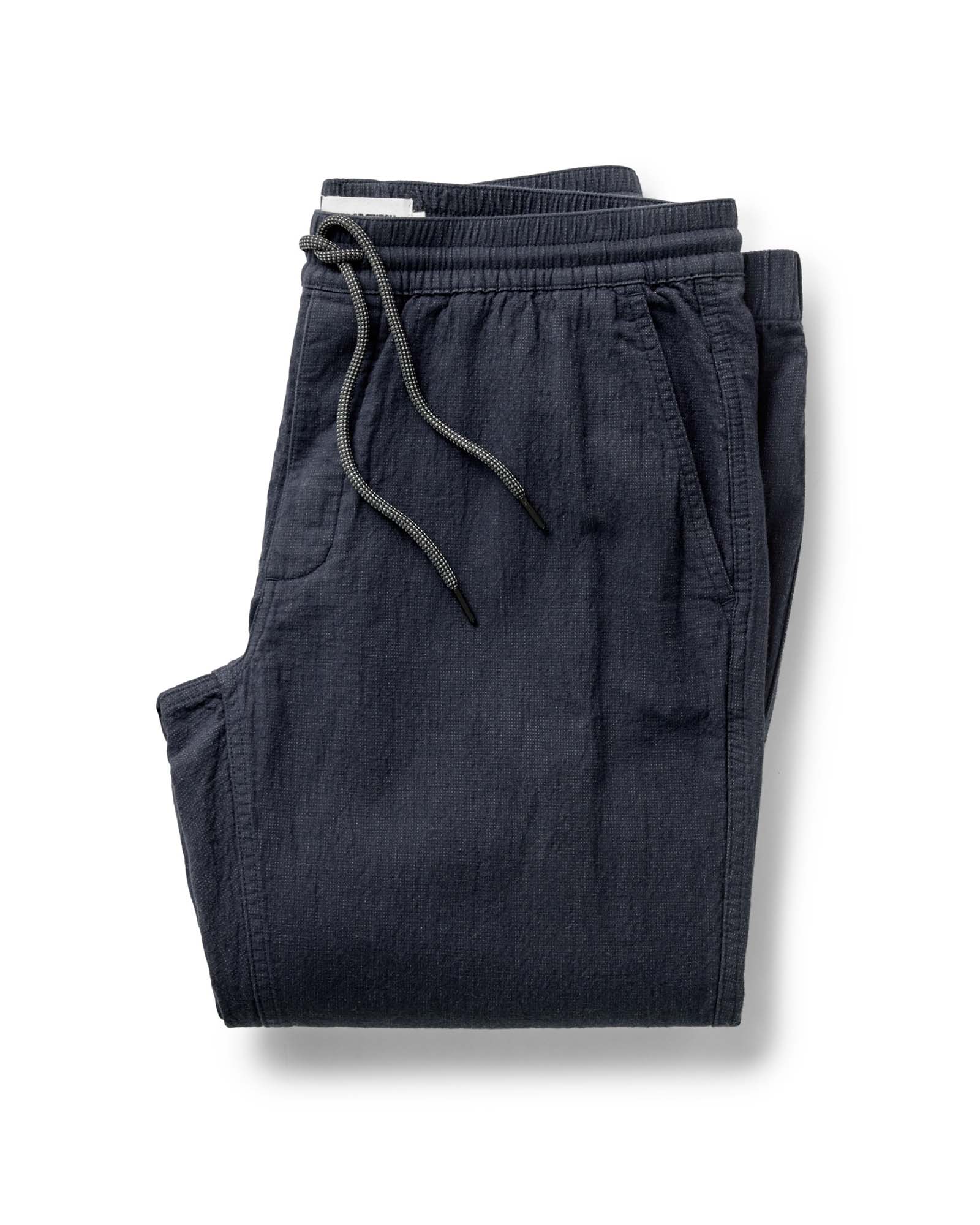 folded flatlay of The Apres Pant in Coal Double Cloth, Bottoms by Taylor Stitch