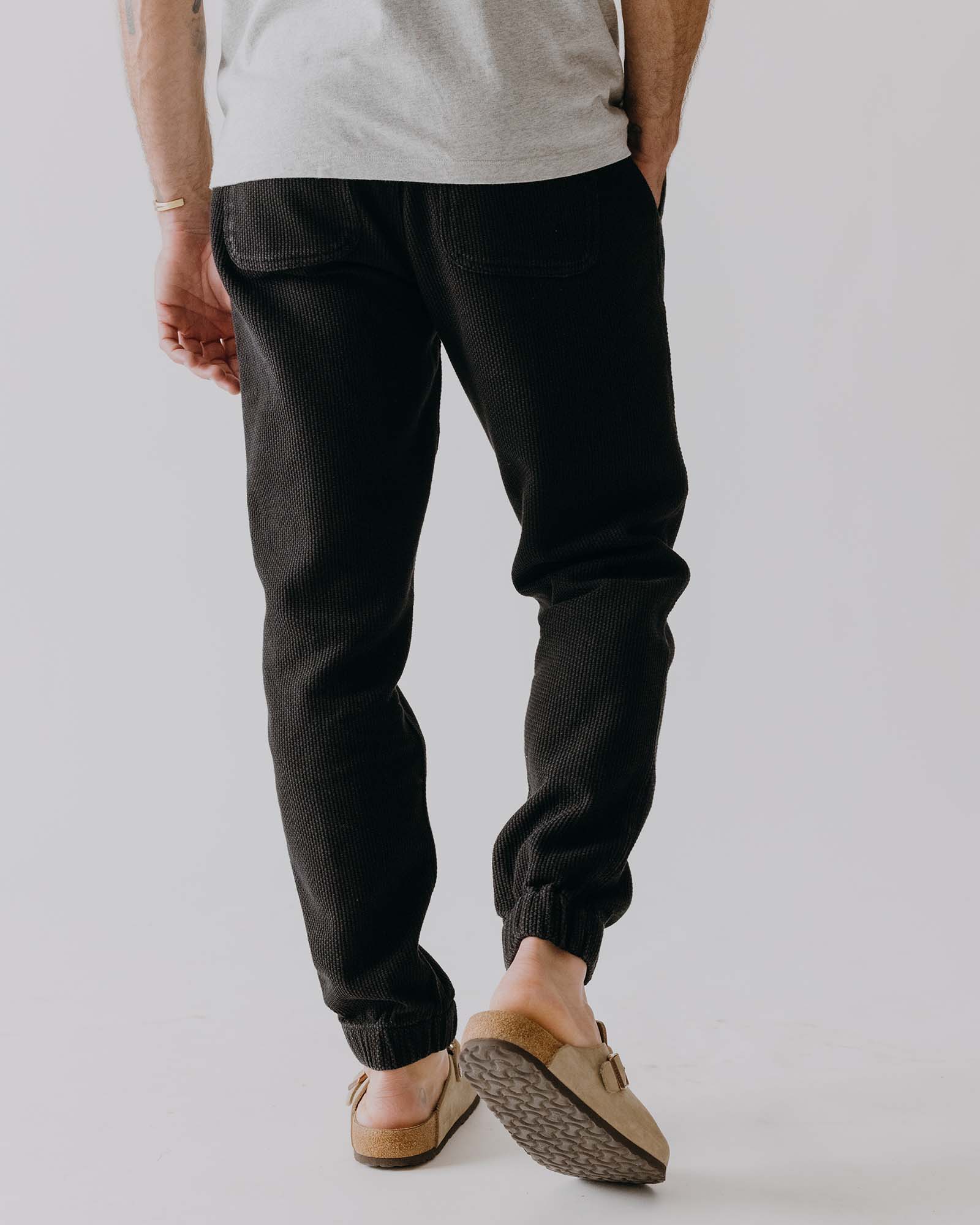 fit model showing off the back of The Apres Pant in Black Indigo Sashiko, Bottoms by Taylor Stitch