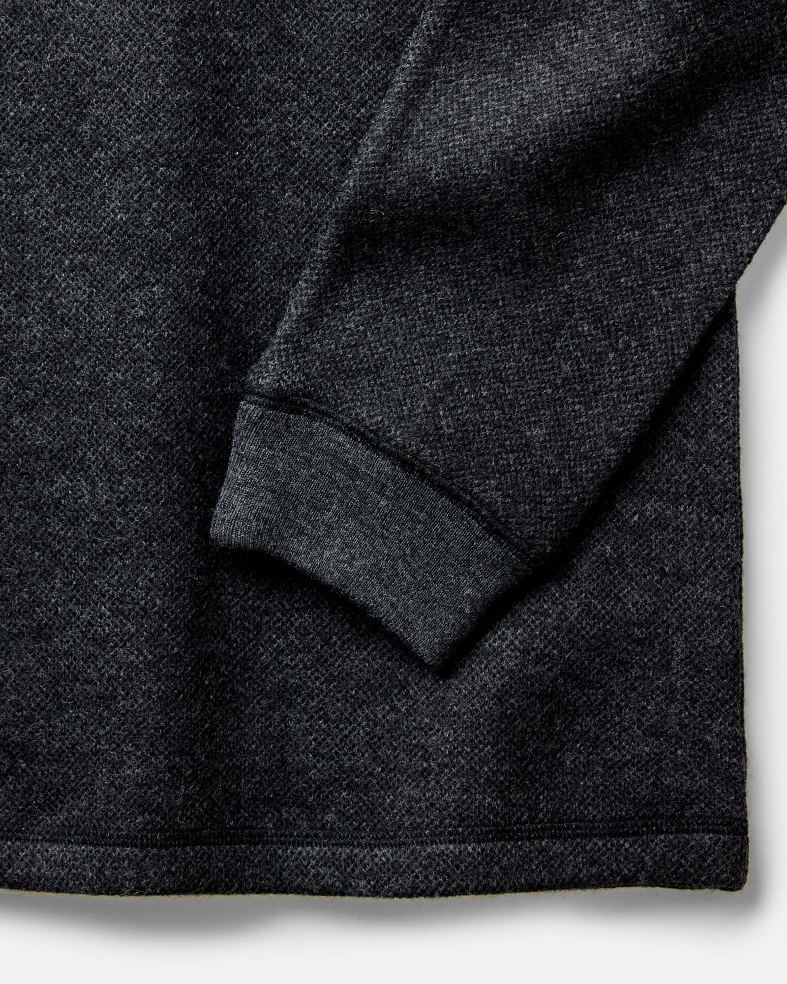 material shot of the sleeves on The Evans Henley in Charcoal Birdseye Wool, Knits by Taylor Stitch