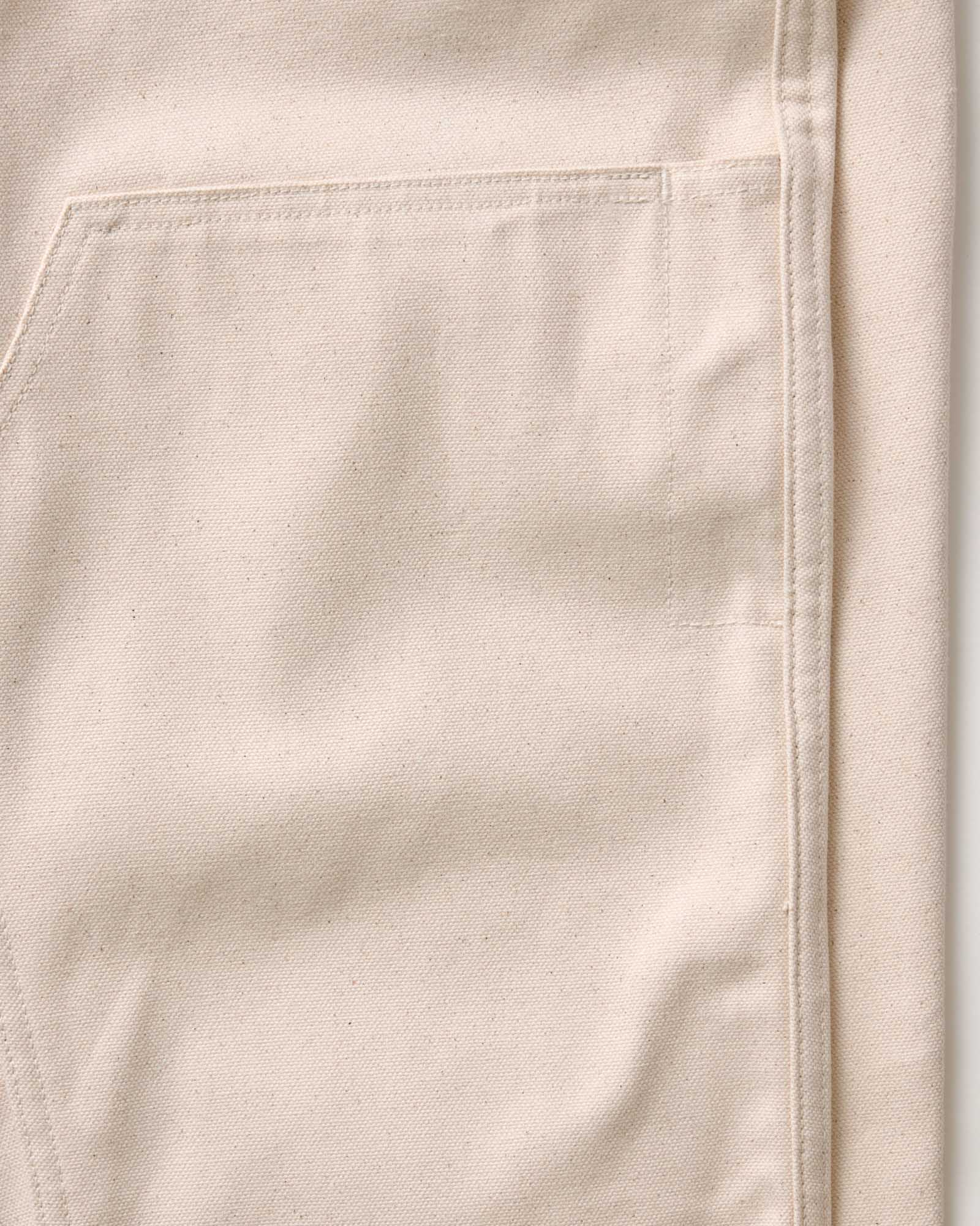 material shot of the double knee imagery on The Good Acre Chore Pant in Natural Canvas, Bottoms by Taylor Stitch