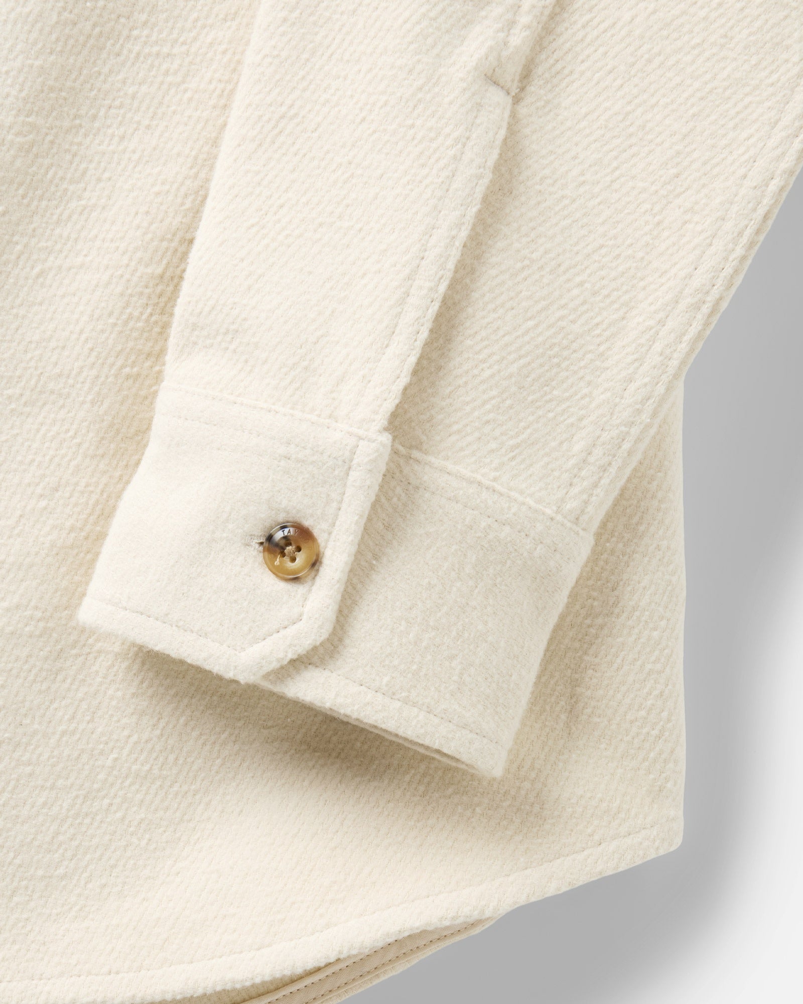 material shot of the sleeve on The Maritime Shirt Jacket in Vintage White Moleskin Twill, Outerwear by Taylor Stitch