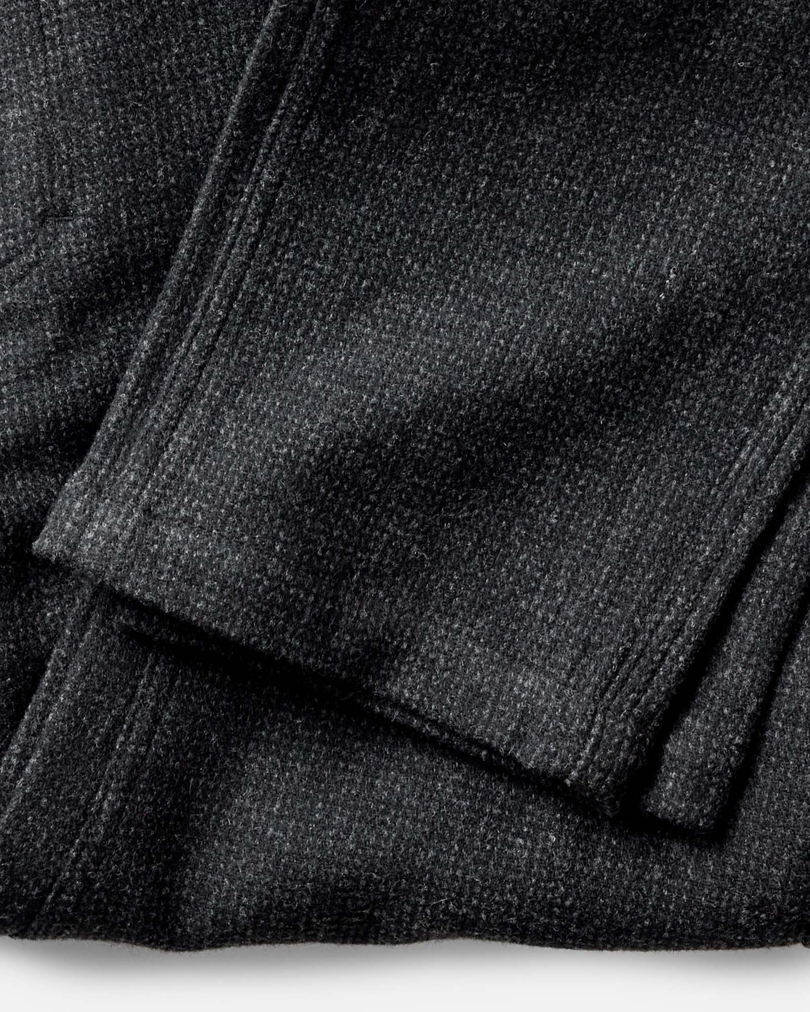 editorial image of the hem on The Carnegie Pant in Heather Charcoal Wool, Bottoms by Taylor Stitch