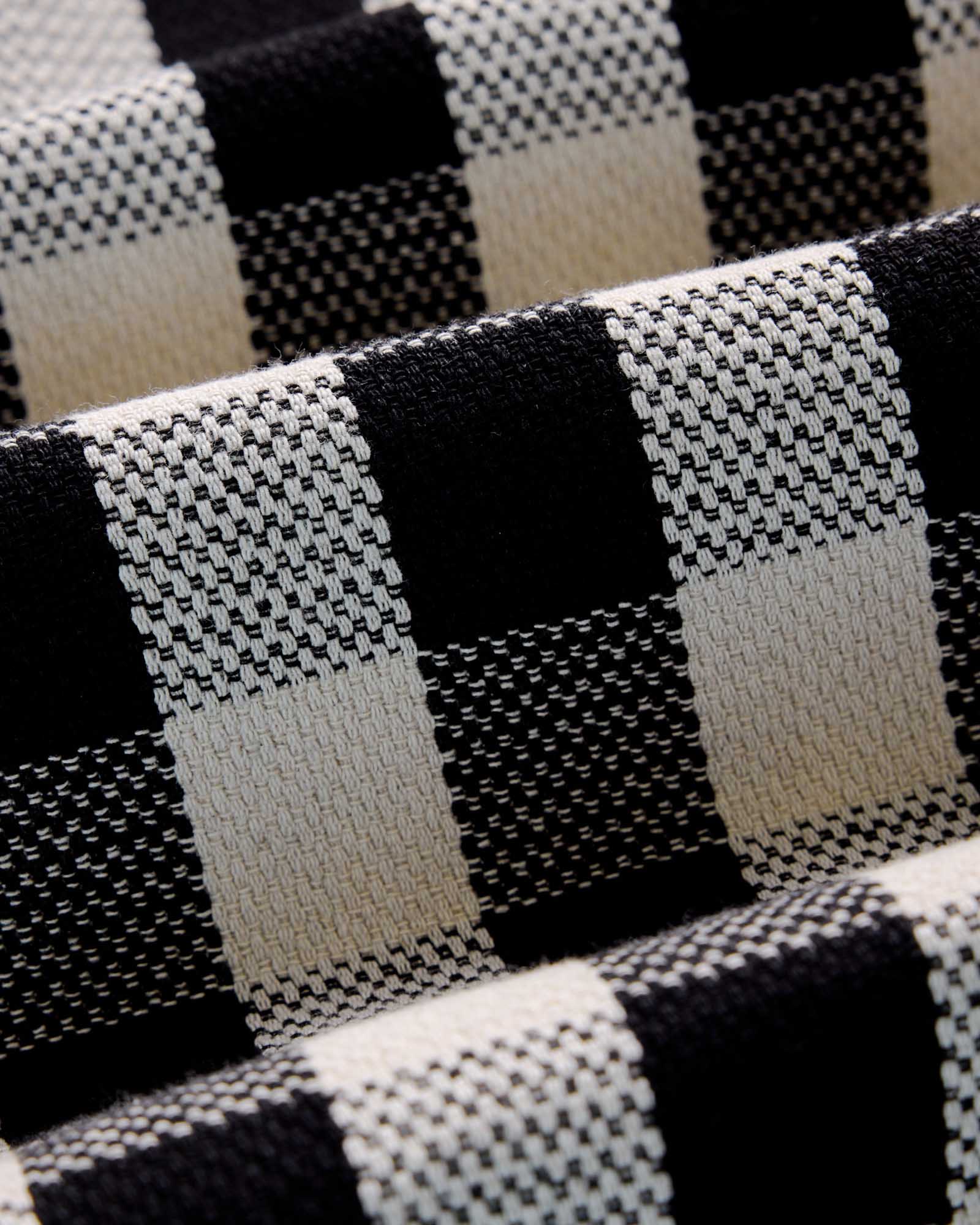 material shot of the fabric on The Division Shirt in Black Indigo Check, Wovens by Taylor Stitch
