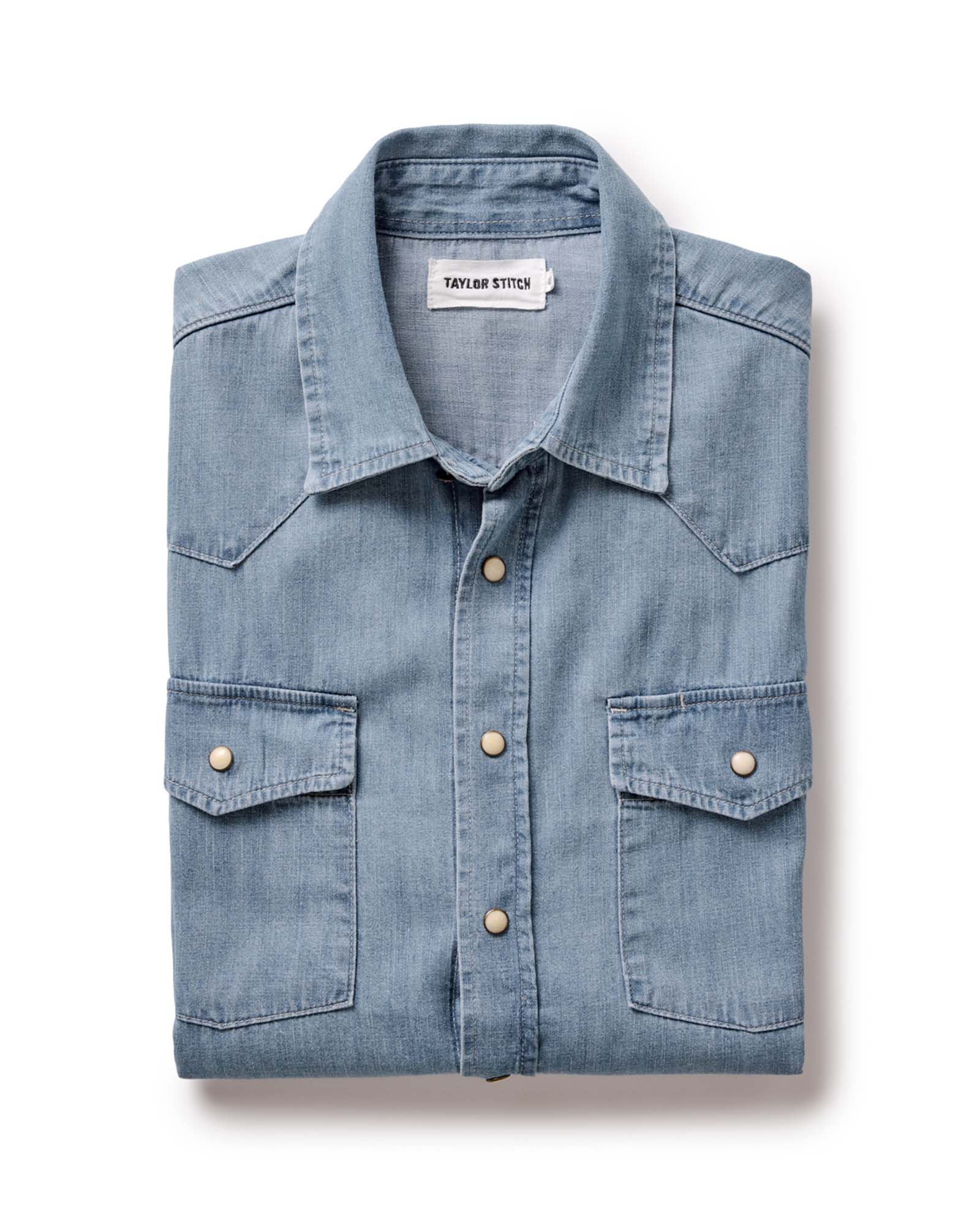 folded flatlay of The Glacier Shirt in Washed Indigo Denim, Wovens by Taylor Stitch
