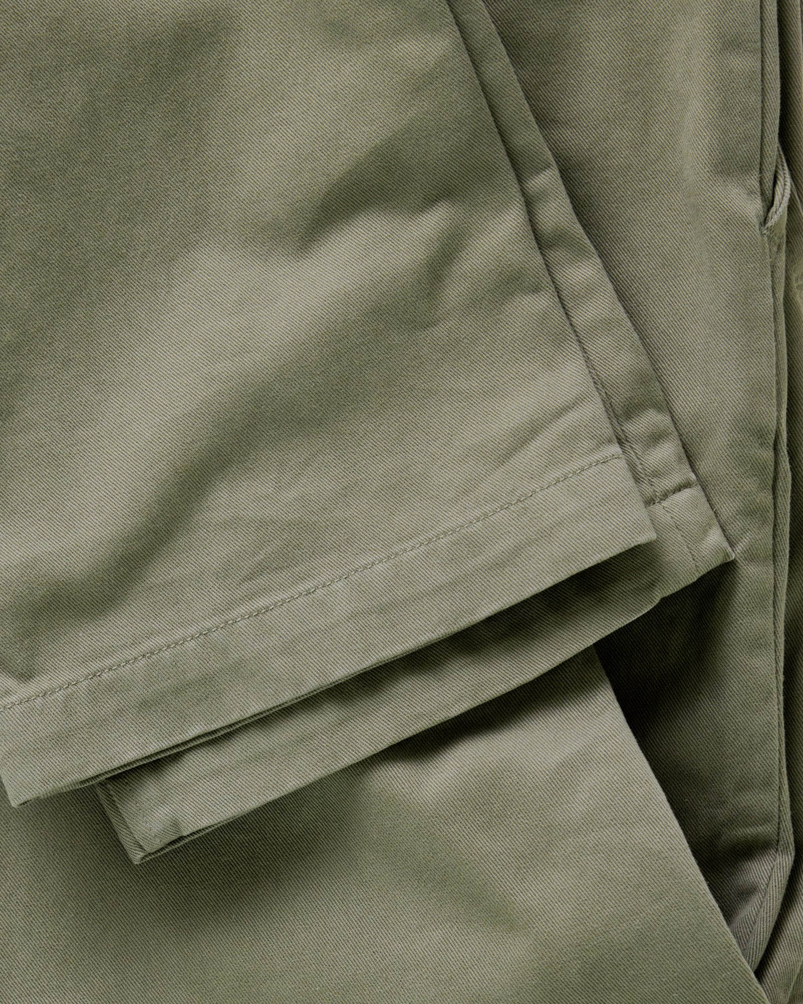 material shot of the leg cuffs on The Slim Foundation Pant in Organic Smoked Olive, Bottoms by Taylor Stitch