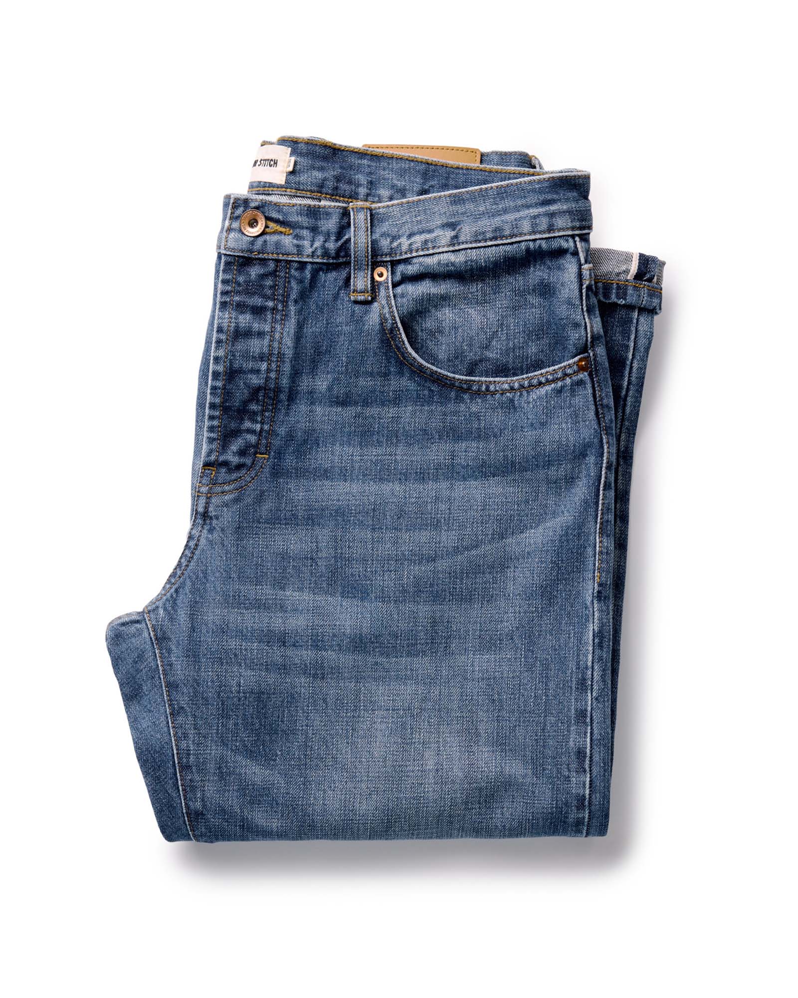 folded flatlay of The Straight Jean in Mid Wash Organic Selvedge, Bottoms by Taylor Stitch