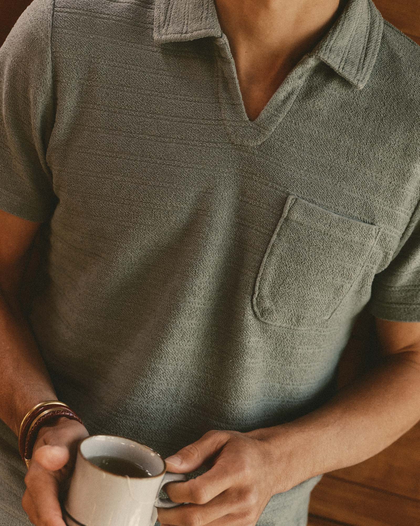 fit model wearing The Meridian Polo in Faded Pine, Knits by Taylor Stitch