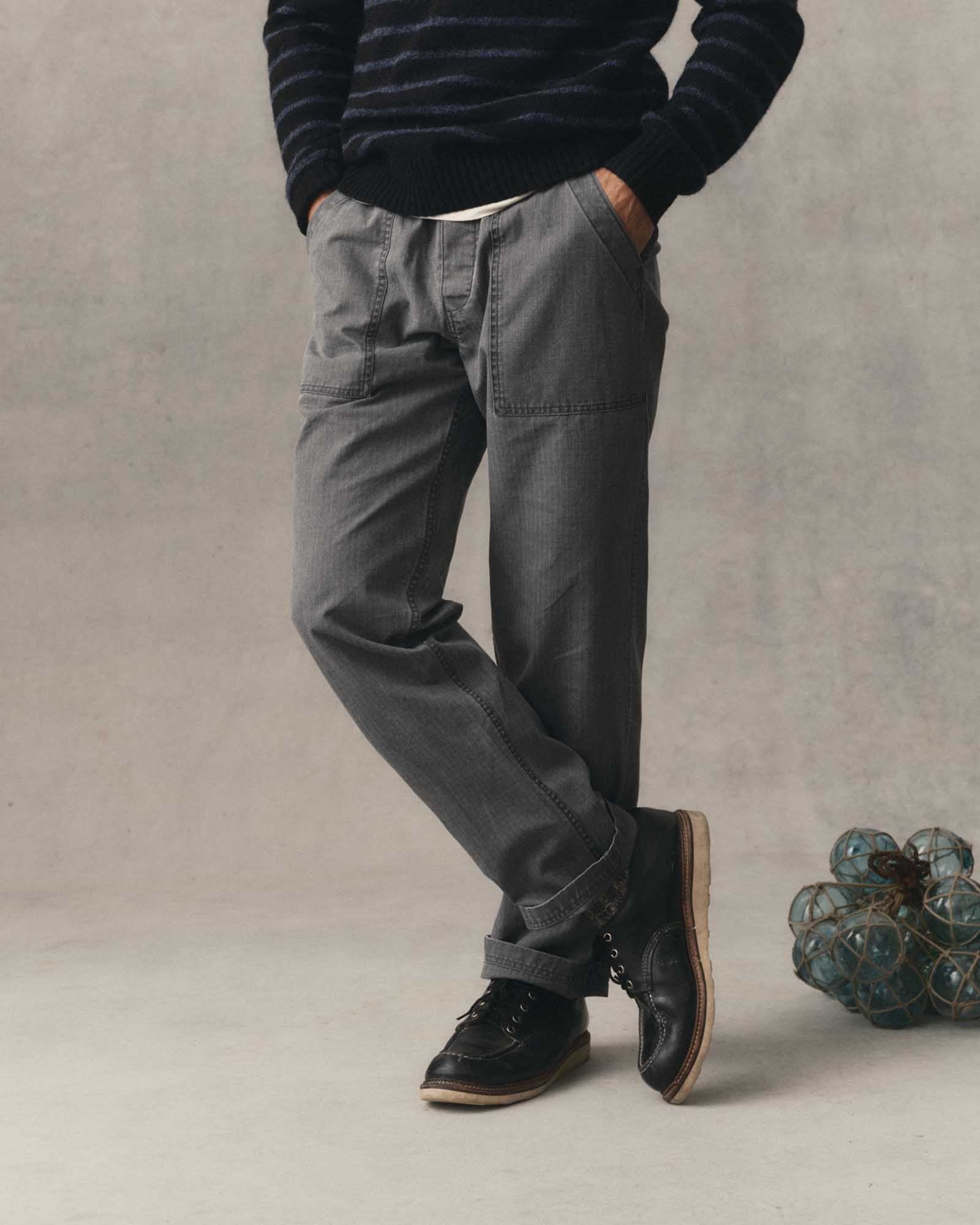 fit model posing in The Breakwater Pant in Dark Grey Ripstop, Bottoms by Taylor Stitch
