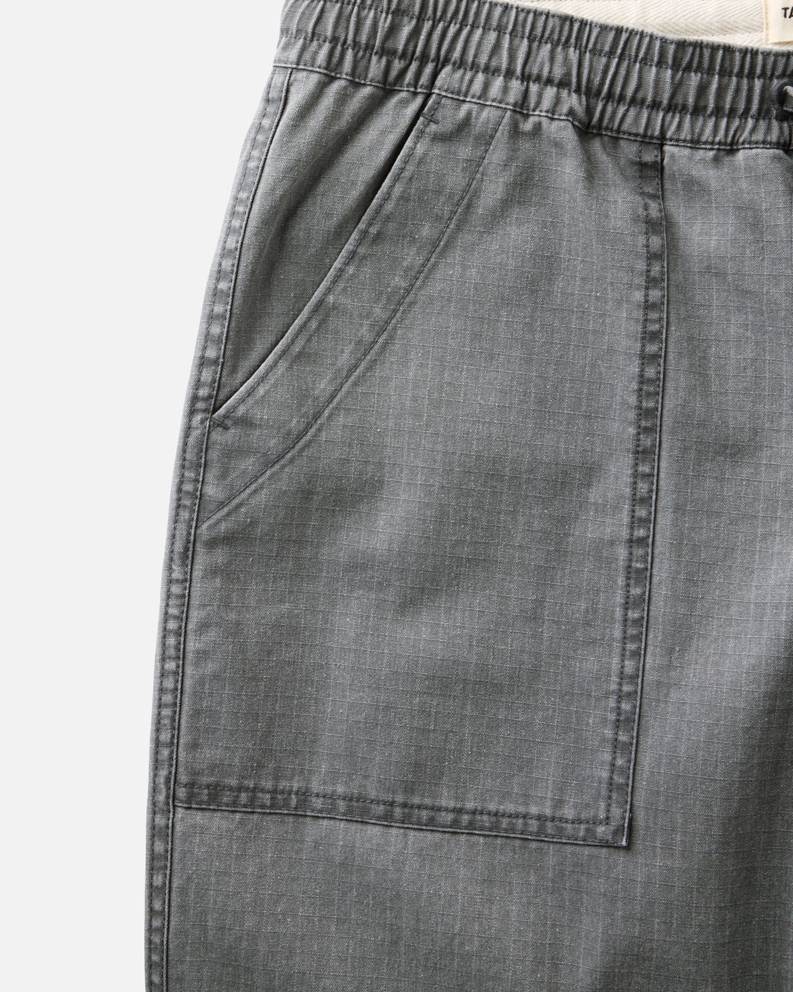 material shot of the pocket on The Breakwater Pant in Dark Grey Ripstop, Bottoms by Taylor Stitch