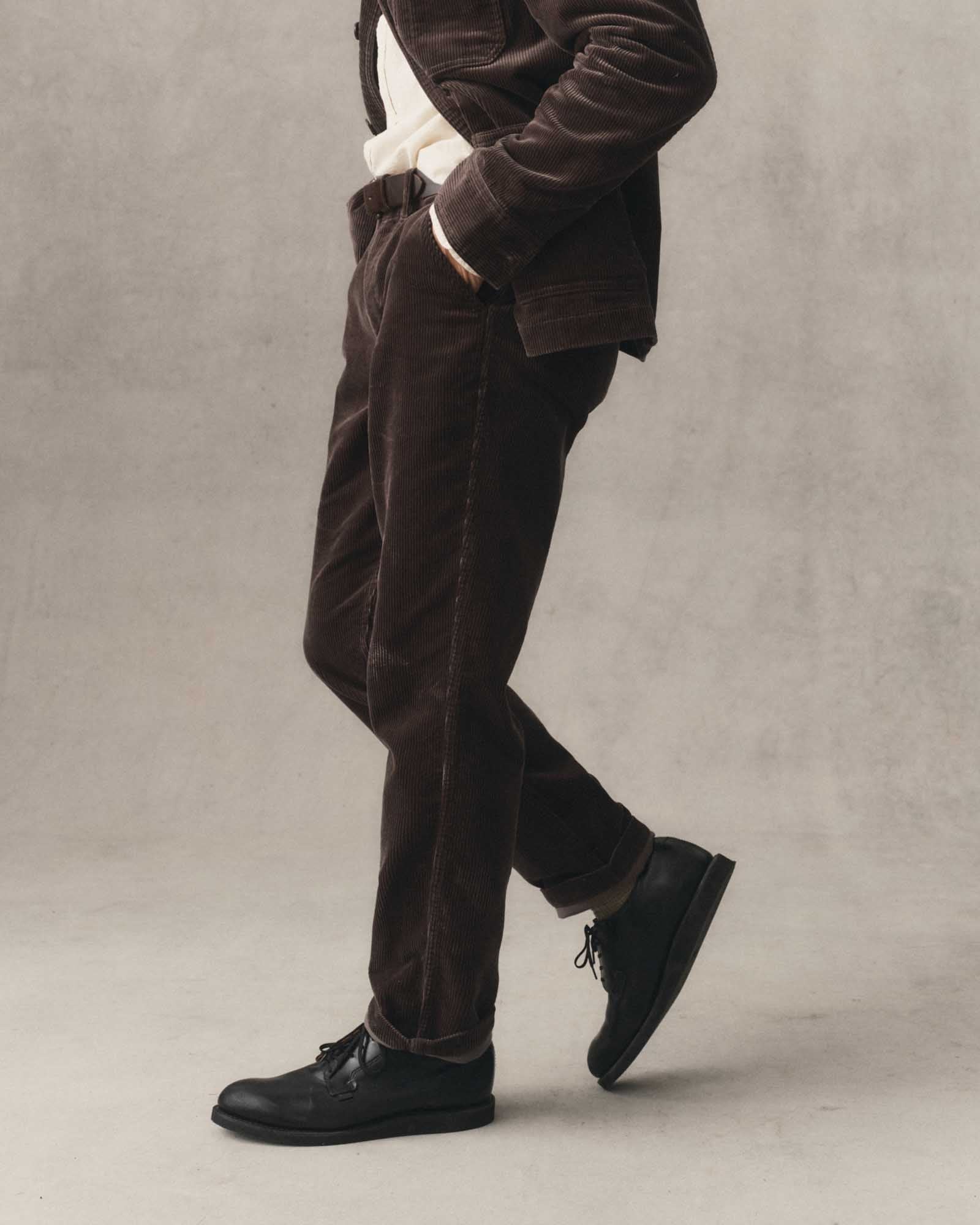 fit model walking wearing The Carnegie Pant in Soil Corduroy, Bottoms by Taylor Stitch