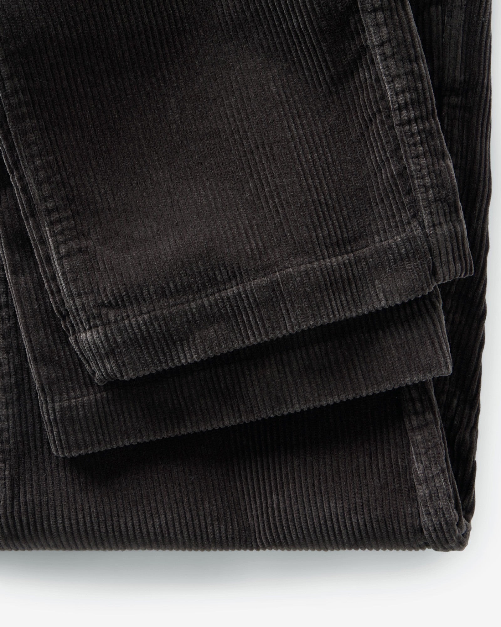 material shot of the hem on The Carnegie Pant in Soil Corduroy, Bottoms by Taylor Stitch