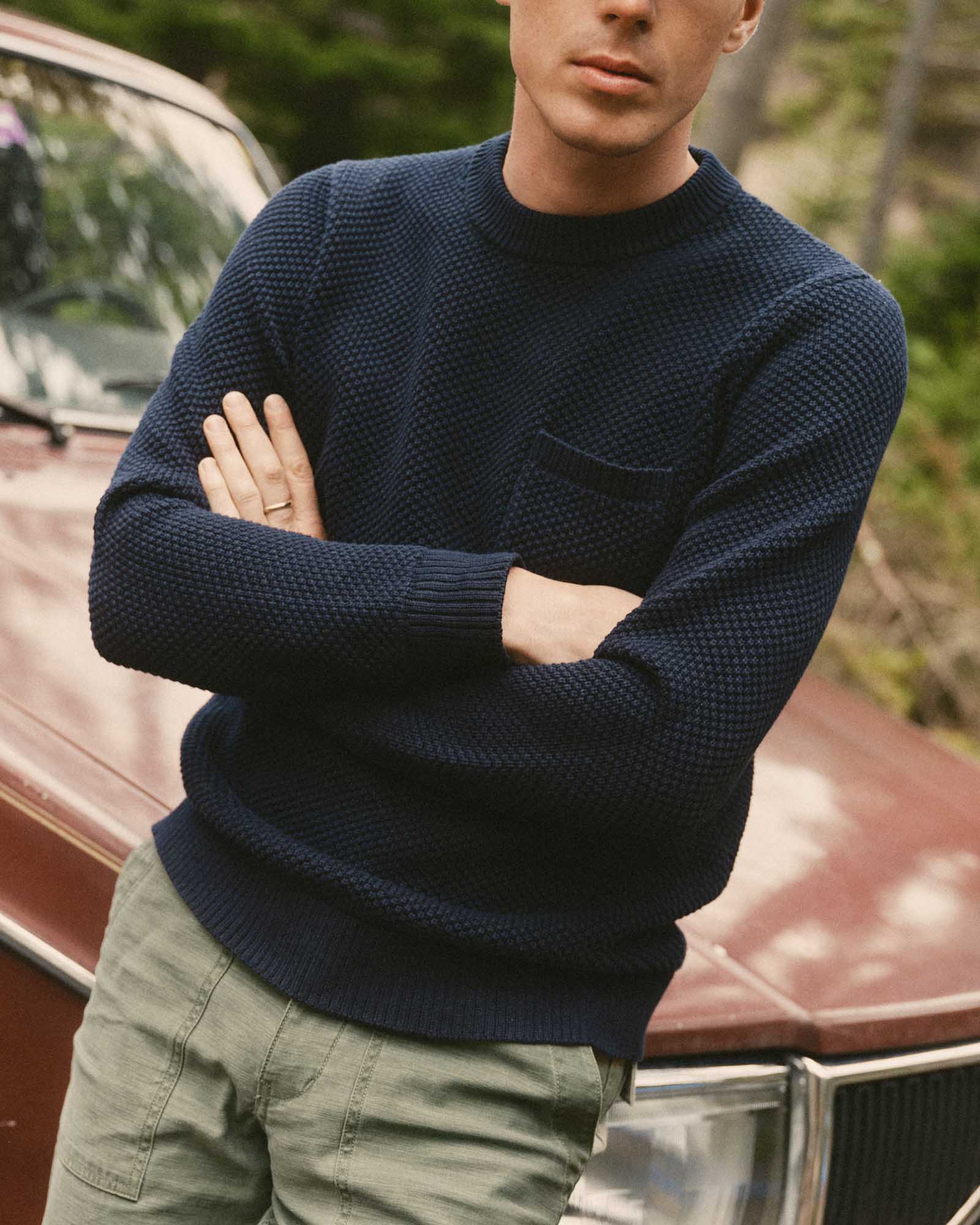 fit model posing in The Crawford Crew Sweater in Navy, Sweaters by Taylor Stitch