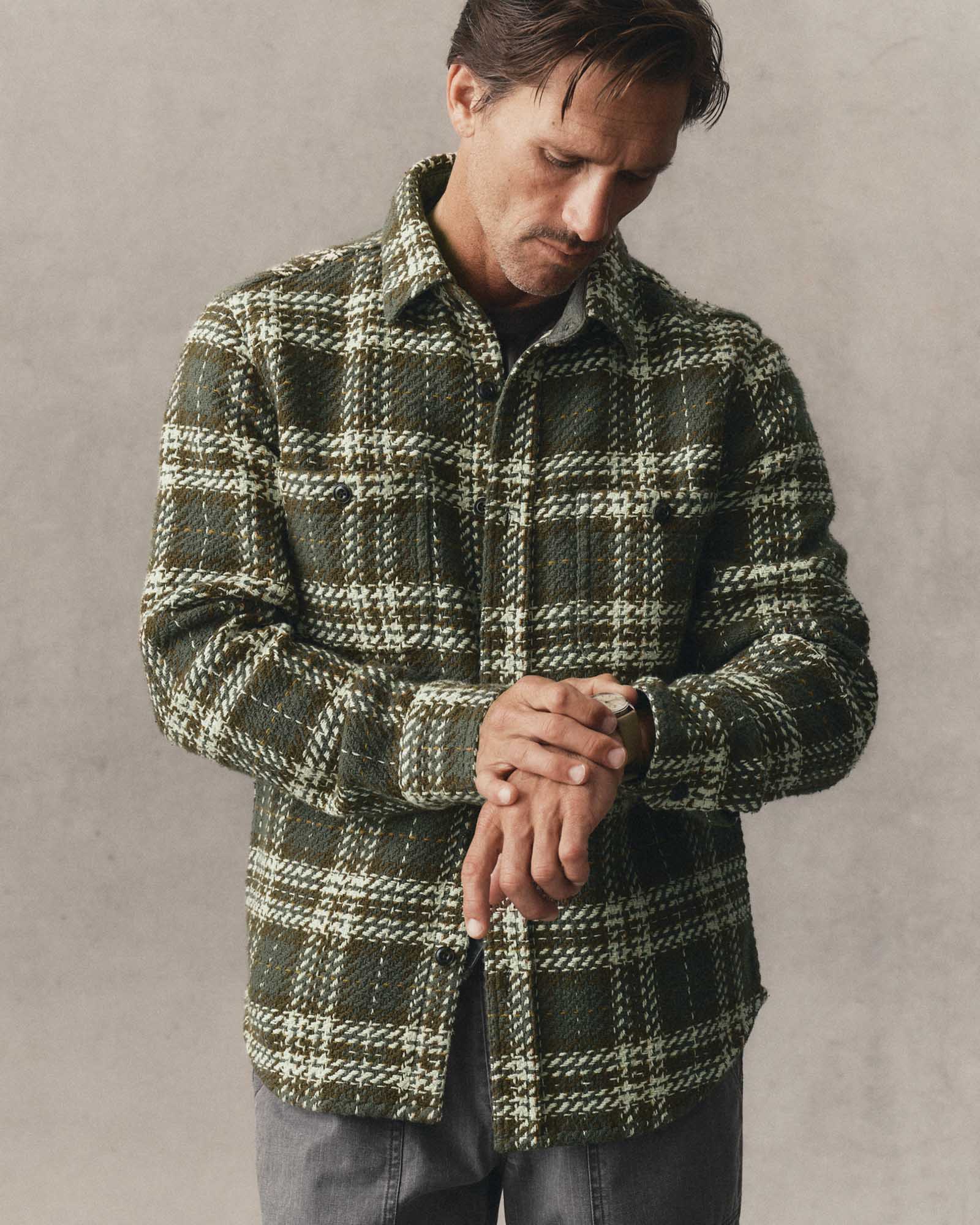 fit model posing in The Cutter Overshirt in Buzzard Check, Wovens by Taylor Stitch