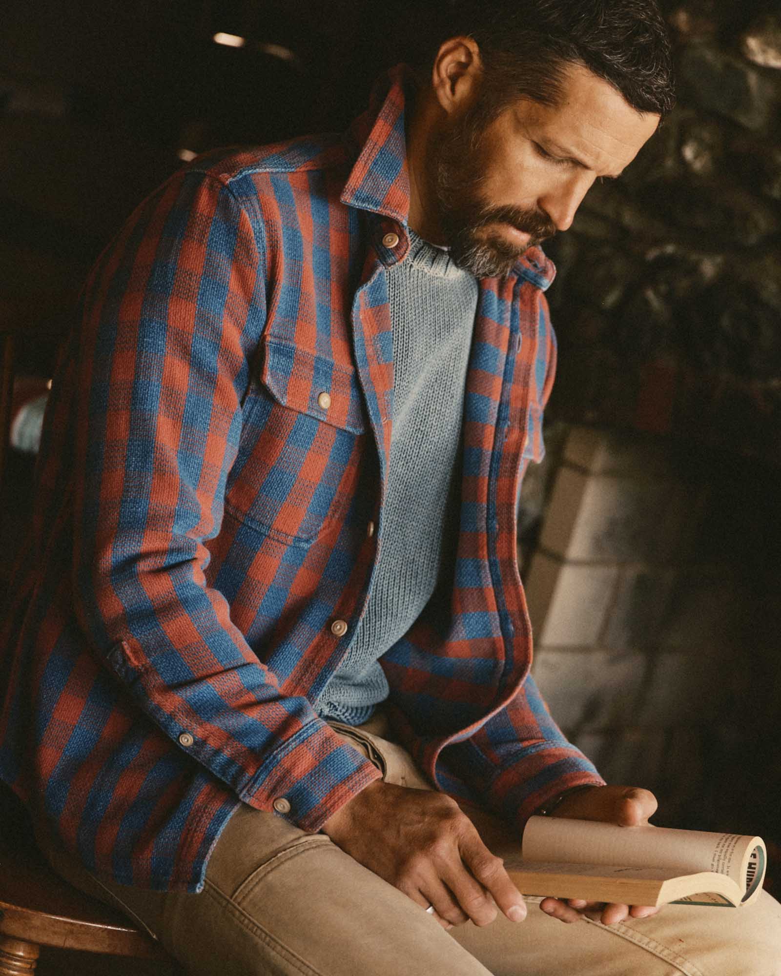 fit model sitting wearing The Division Shirt in Sunset Check, Wovens by Taylor Stitch