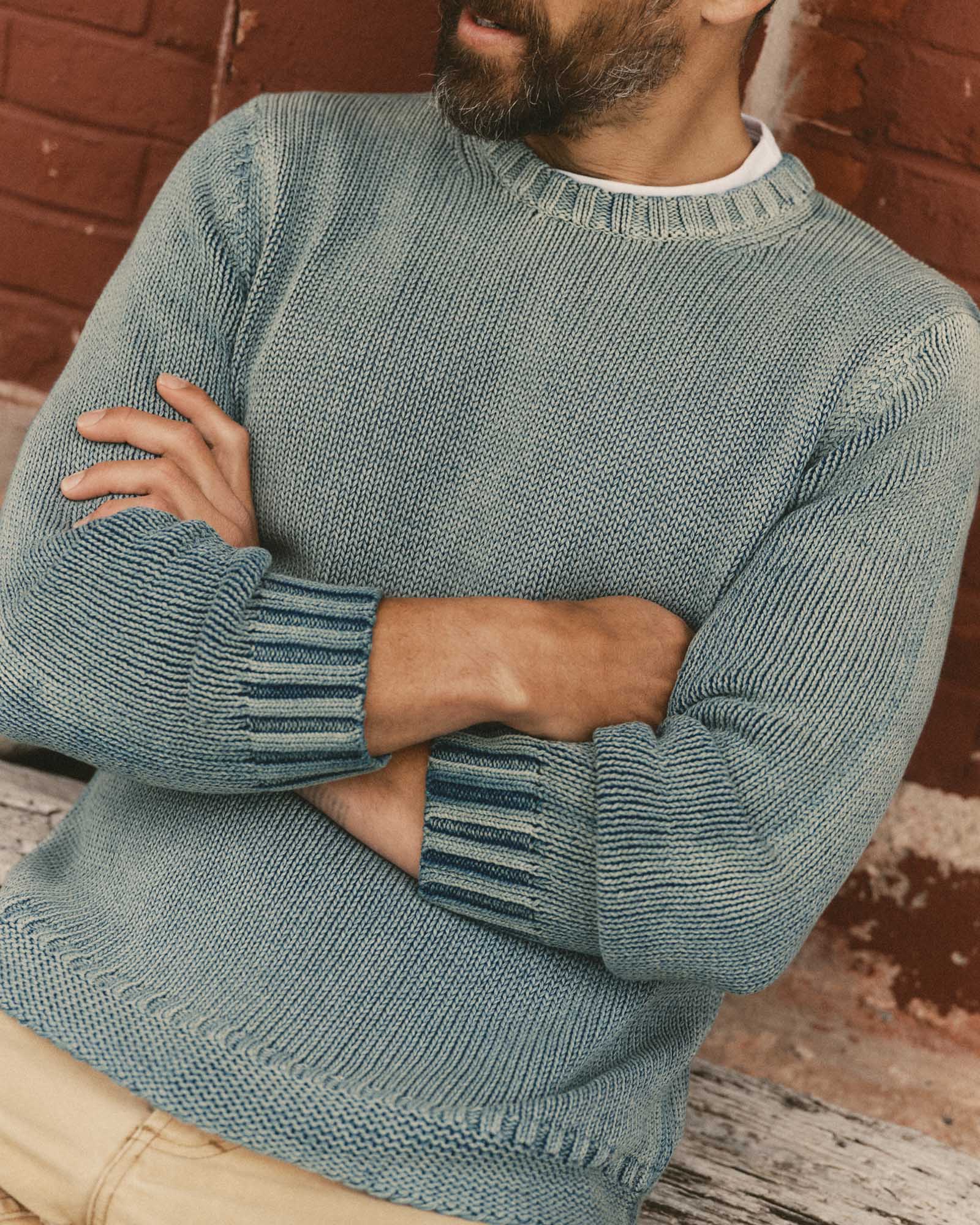fit model with his arms crossed wearing The Dory Crew Sweater in Washed Indigo, Knits by Taylor Stitch