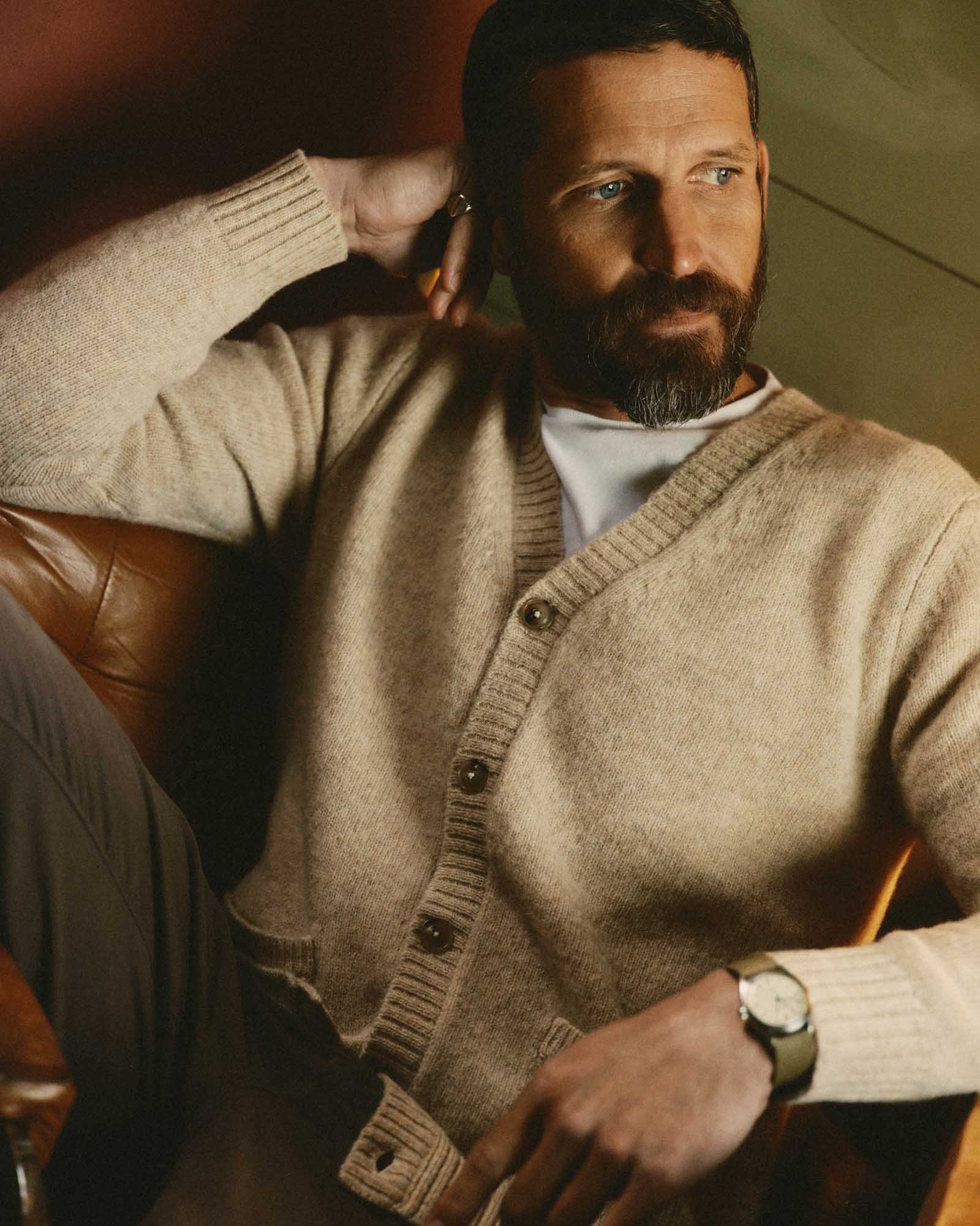 fit model sitting wearing The Eastmoor Cardigan in Oatmeal Wool, Knits by Taylor Stitch