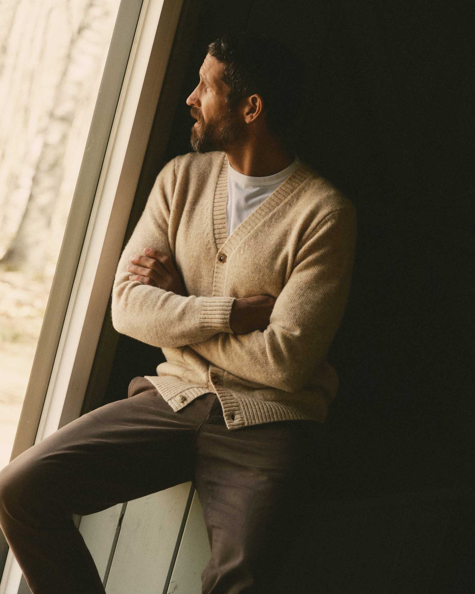 fit model posing in The Eastmoor Cardigan in Oatmeal Wool, Knits by Taylor Stitch