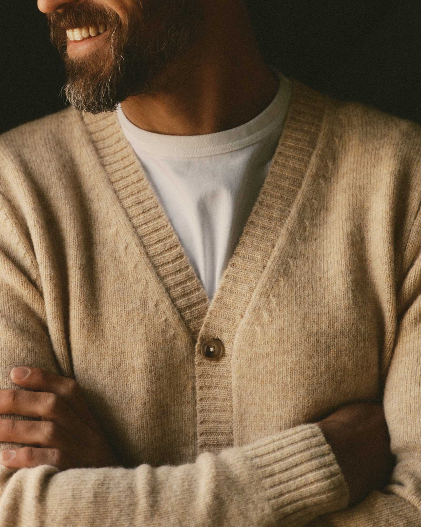 fit model with his arms crossed wearing The Eastmoor Cardigan in Oatmeal Wool, Knits by Taylor Stitch