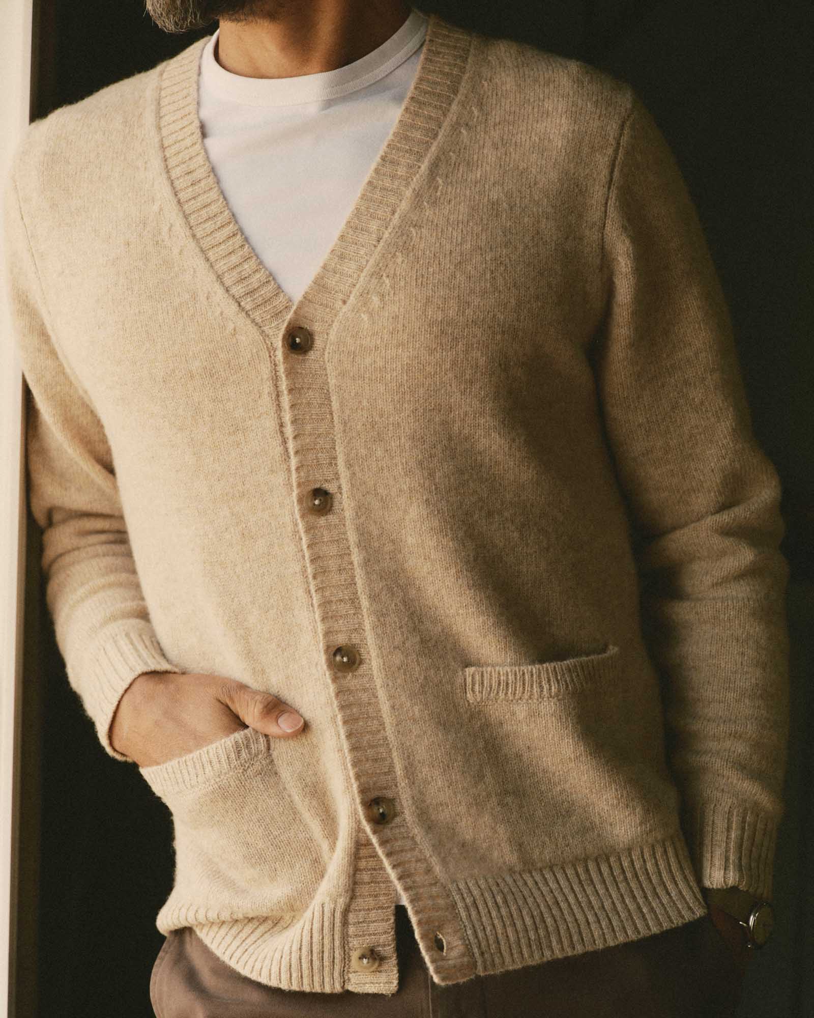 fit model with his hand in the pocket of The Eastmoor Cardigan in Oatmeal Wool, Knits by Taylor Stitch