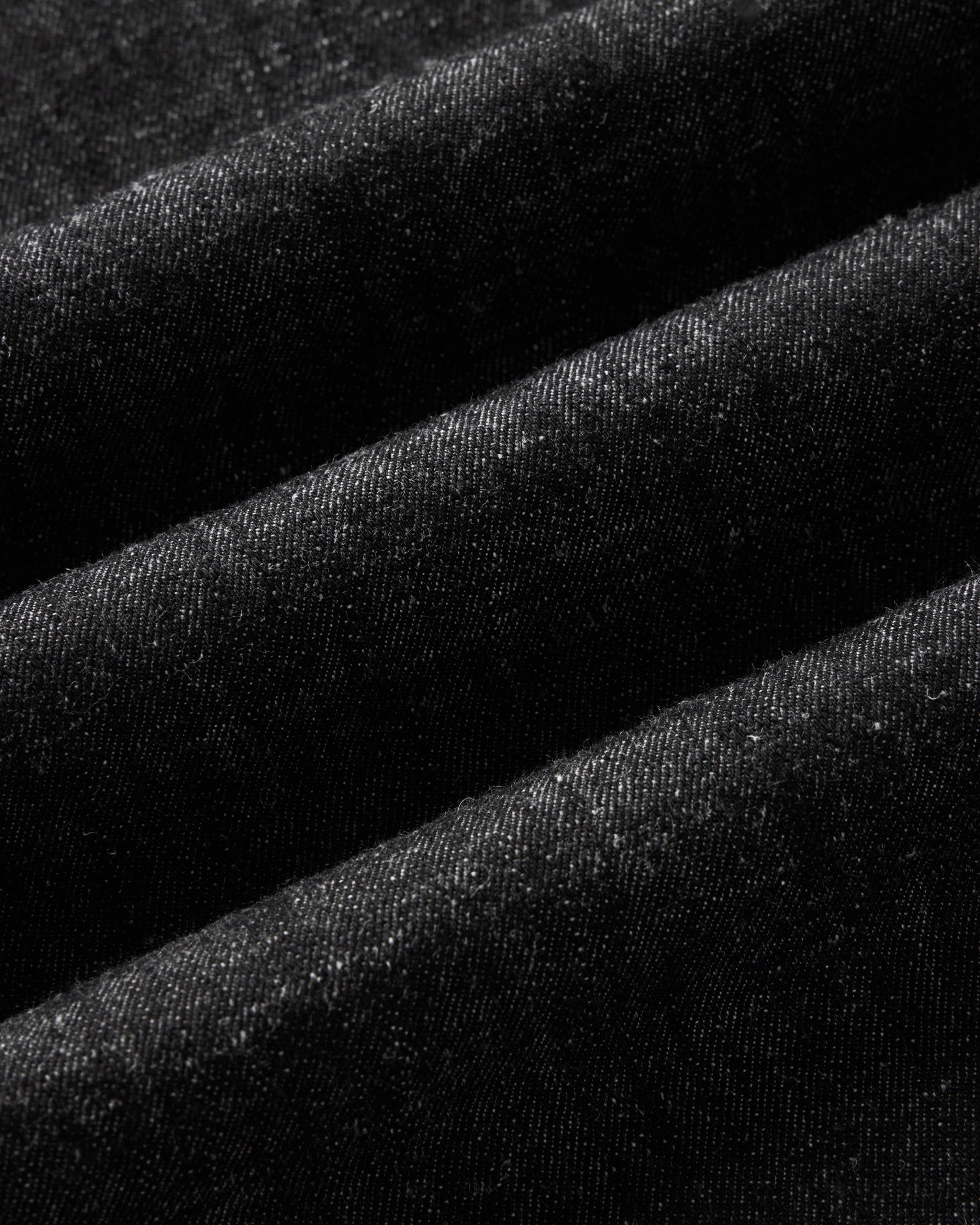 material shot of the fabric on The Glacier Shirt in Black Indigo Hemp Denim, Wovens by Taylor Stitch