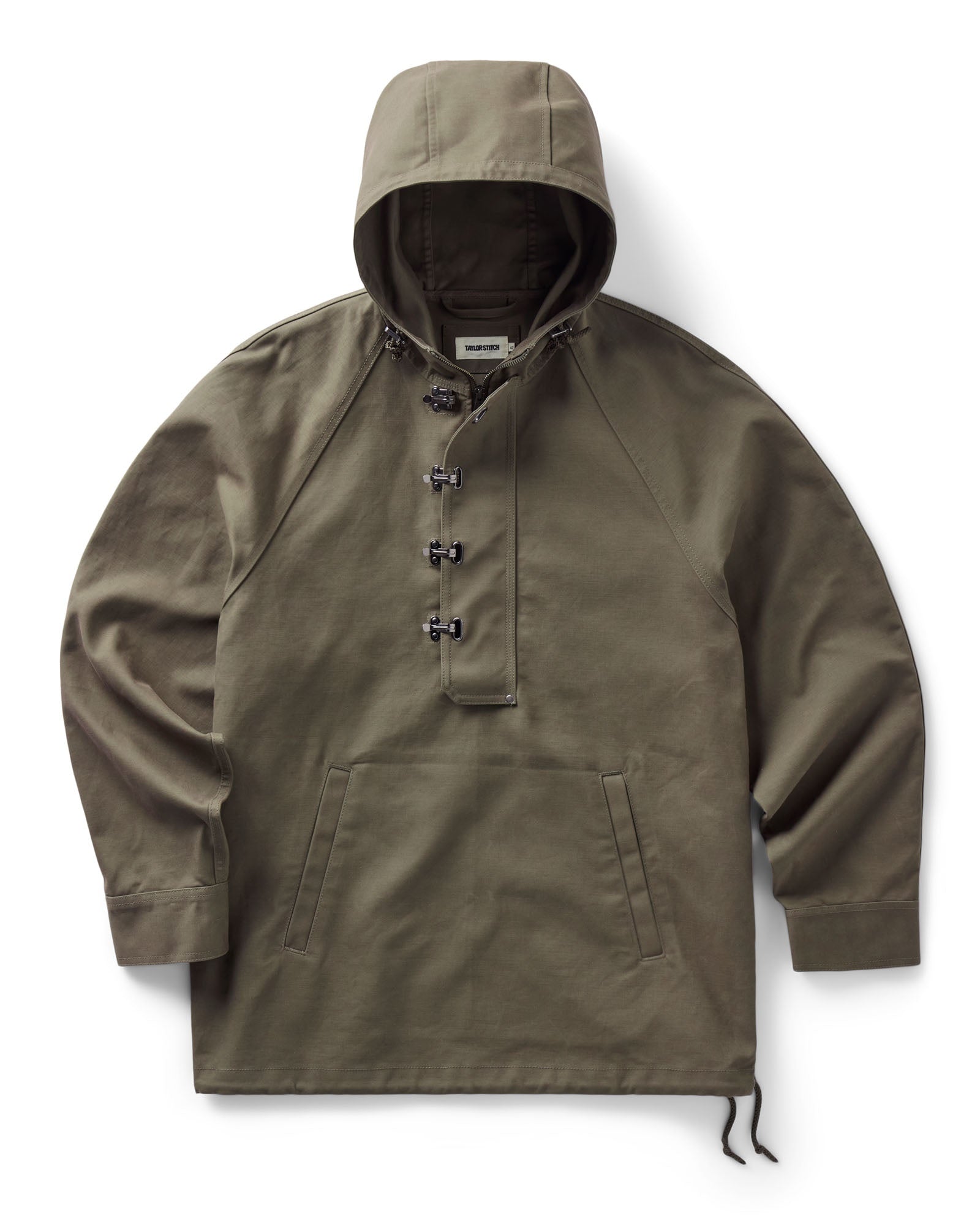 flatlay of The Hatteras Anorak in Fatigue Olive Dry Wax Canvas, Outerwear by Taylor Stitch