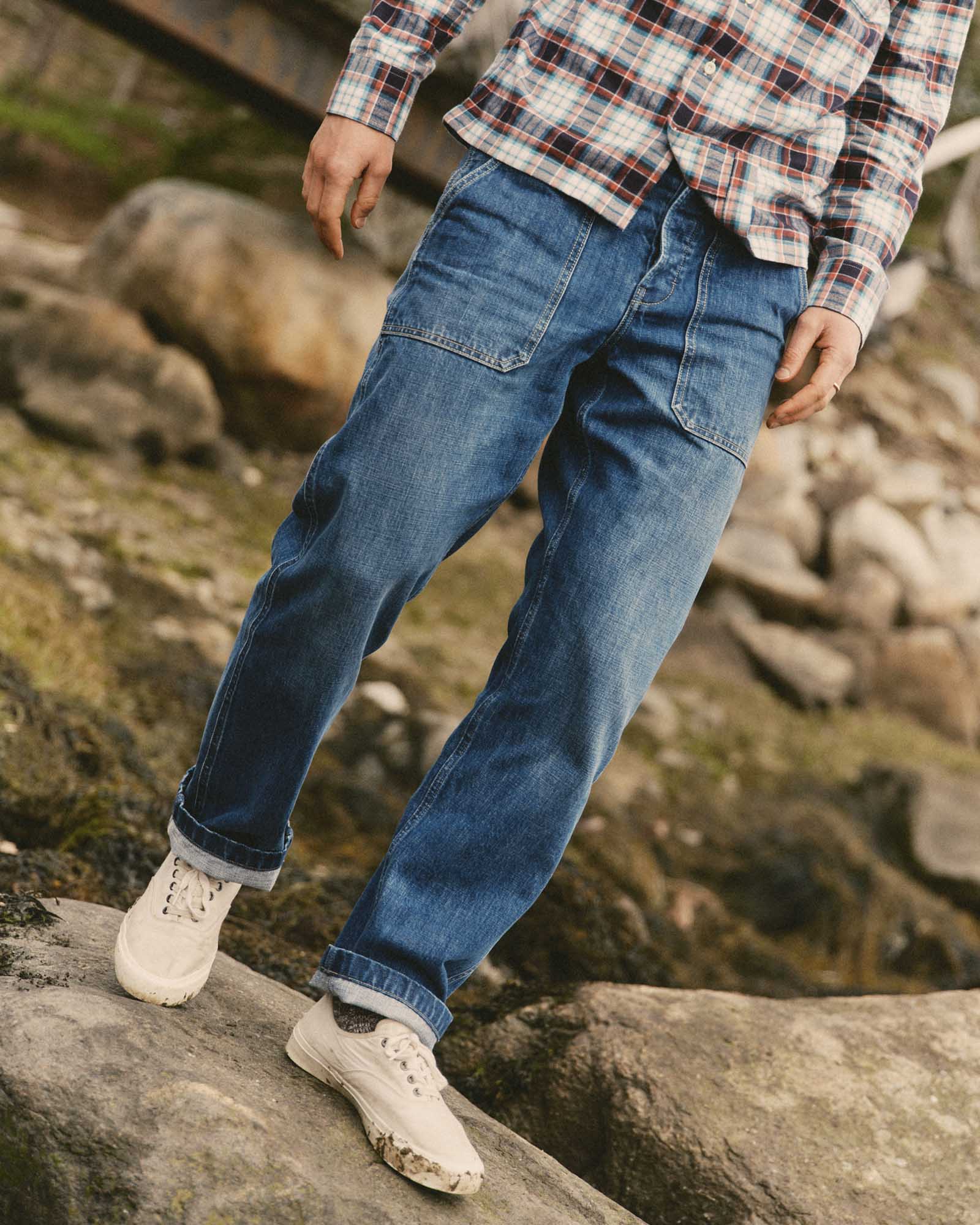 fit model walking wearing The Mariner Jean in Drift Wash Organic Selvedge, Bottoms by Taylor Stitch
