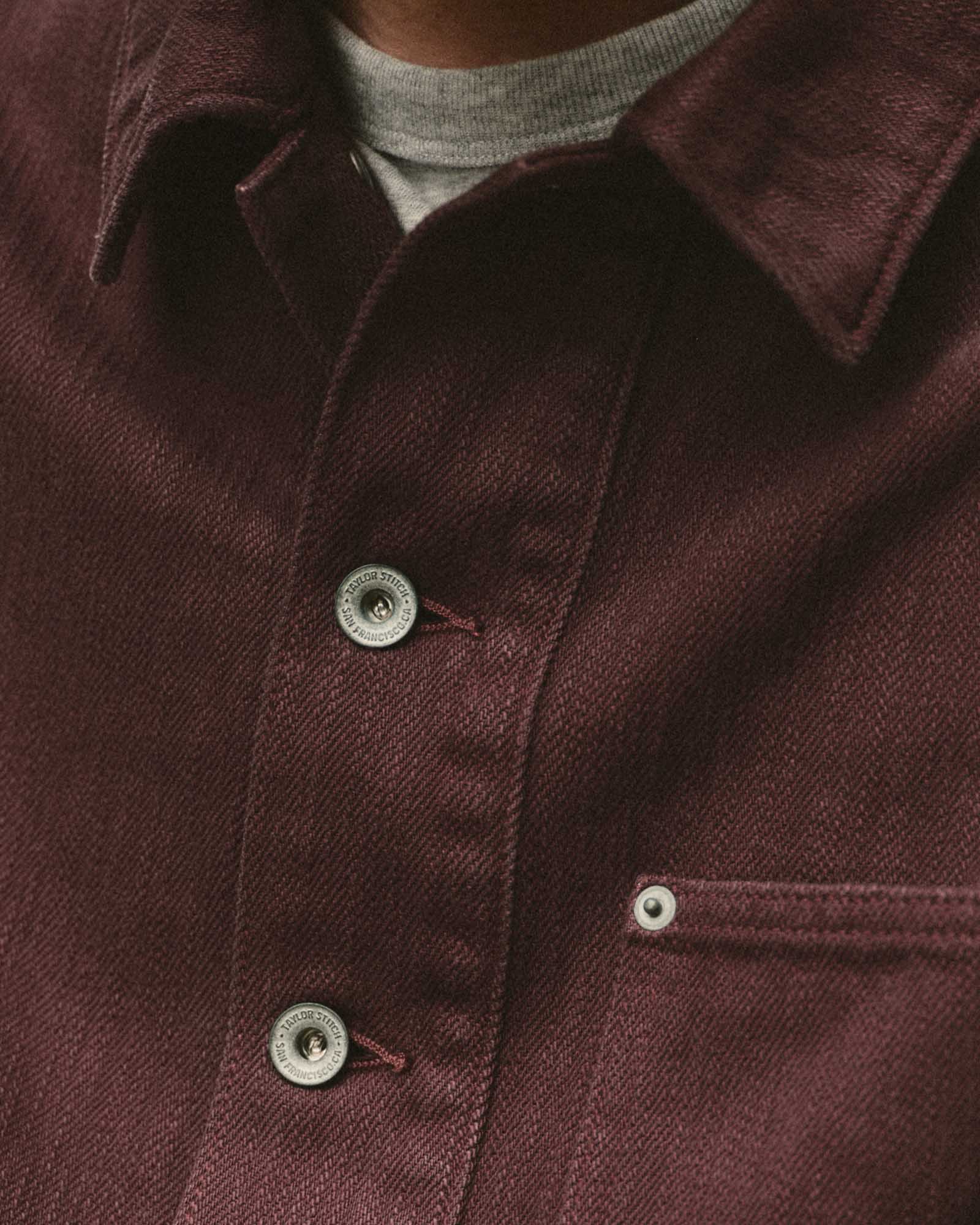 fit model showing off the buttons on The Milton Overshirt in Burgundy Slub Denim, Outerwear by Taylor Stitch