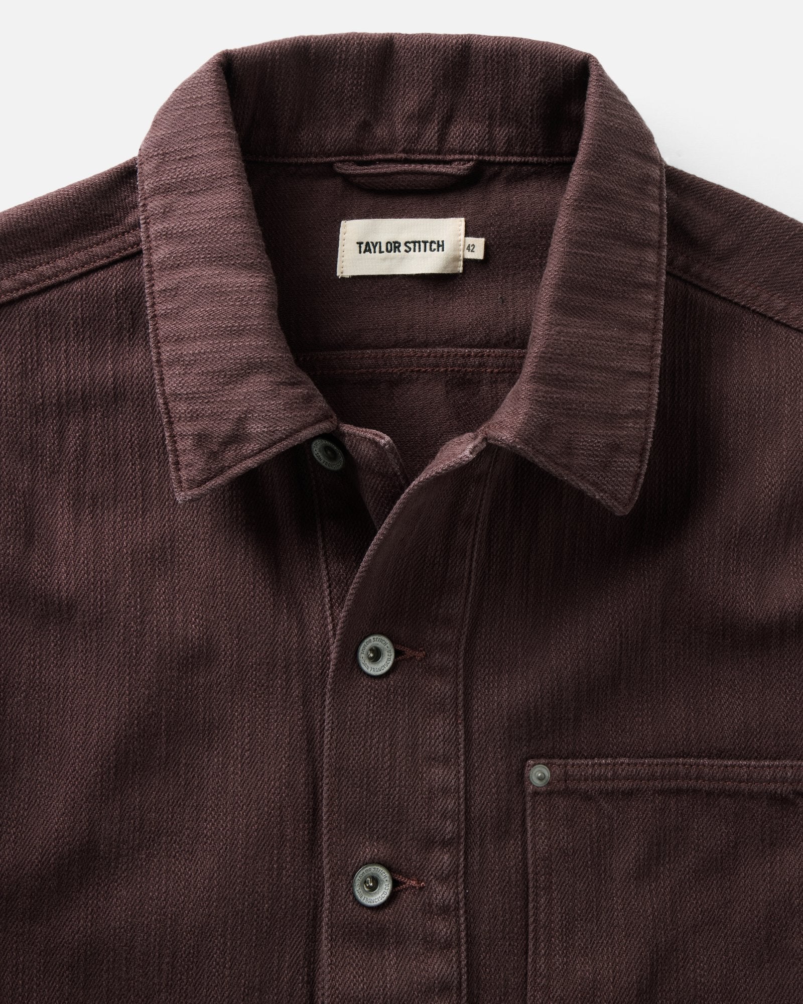 material shot of the collar on The Milton Overshirt in Burgundy Slub Denim, Outerwear by Taylor Stitch