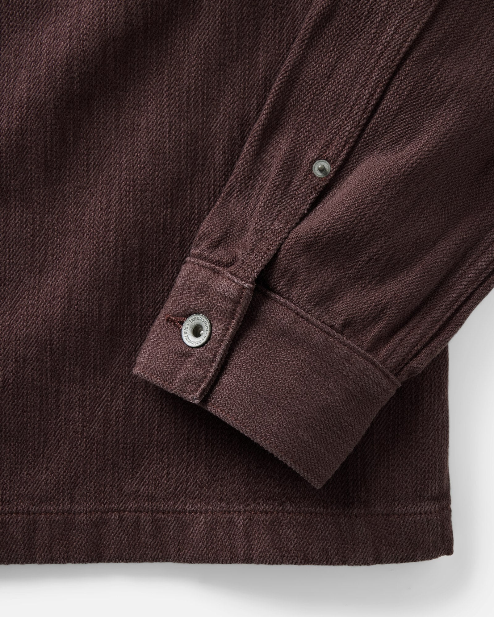 material shot of the sleeve on The Milton Overshirt in Burgundy Slub Denim, Outerwear by Taylor Stitch