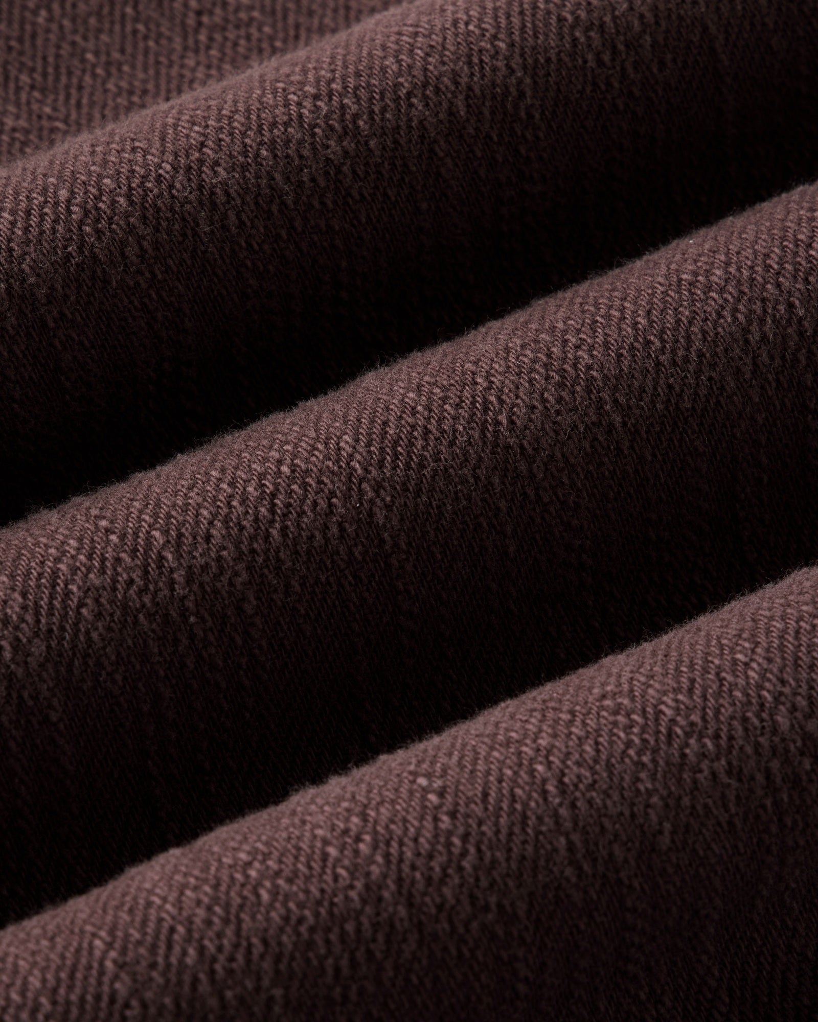 material shot of the fabric on The Milton Overshirt in Burgundy Slub Denim, Outerwear by Taylor Stitch