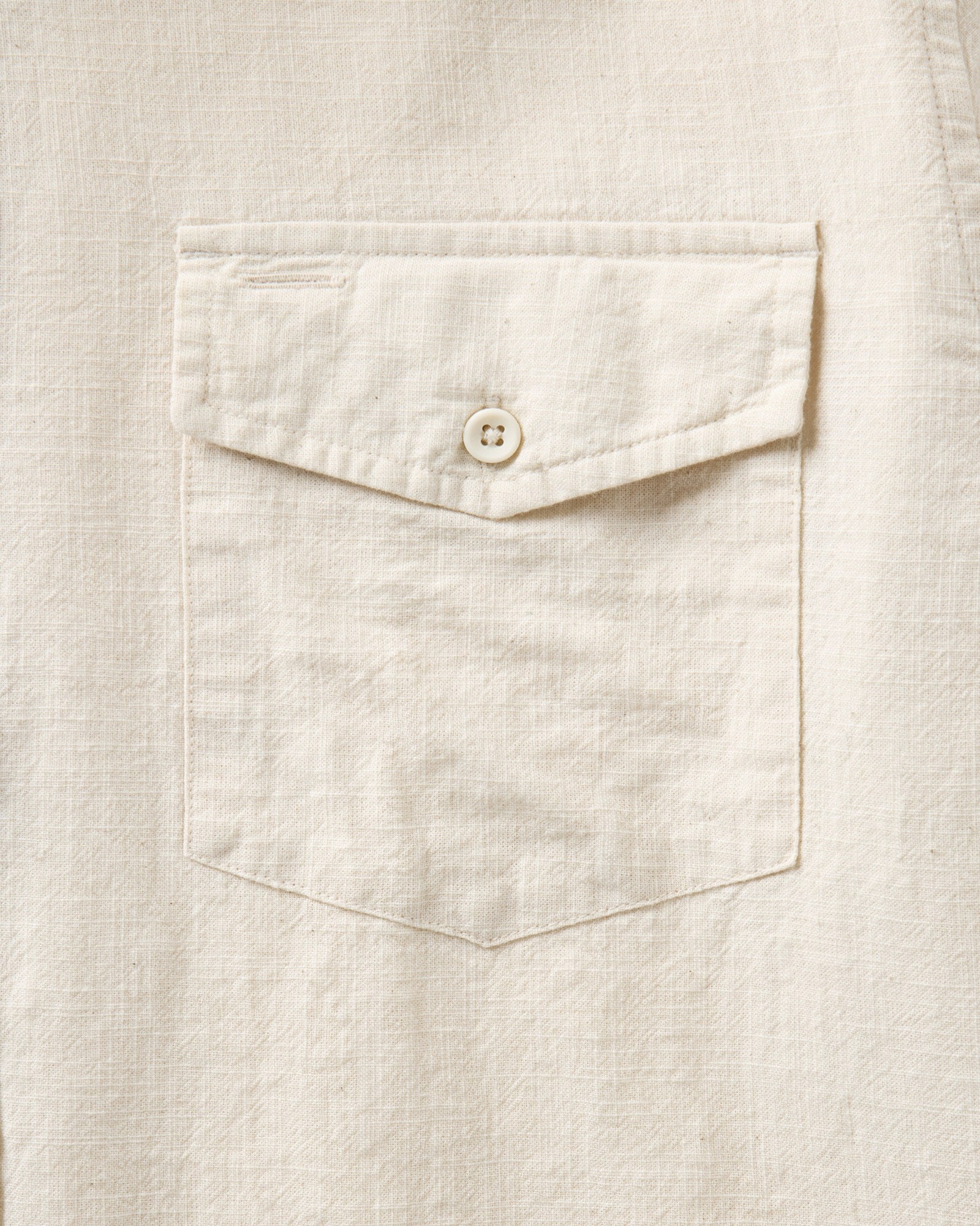 material shot of the pocket on The Quincy Shirt in Vintage White Slub, Wovens by Taylor Stitch
