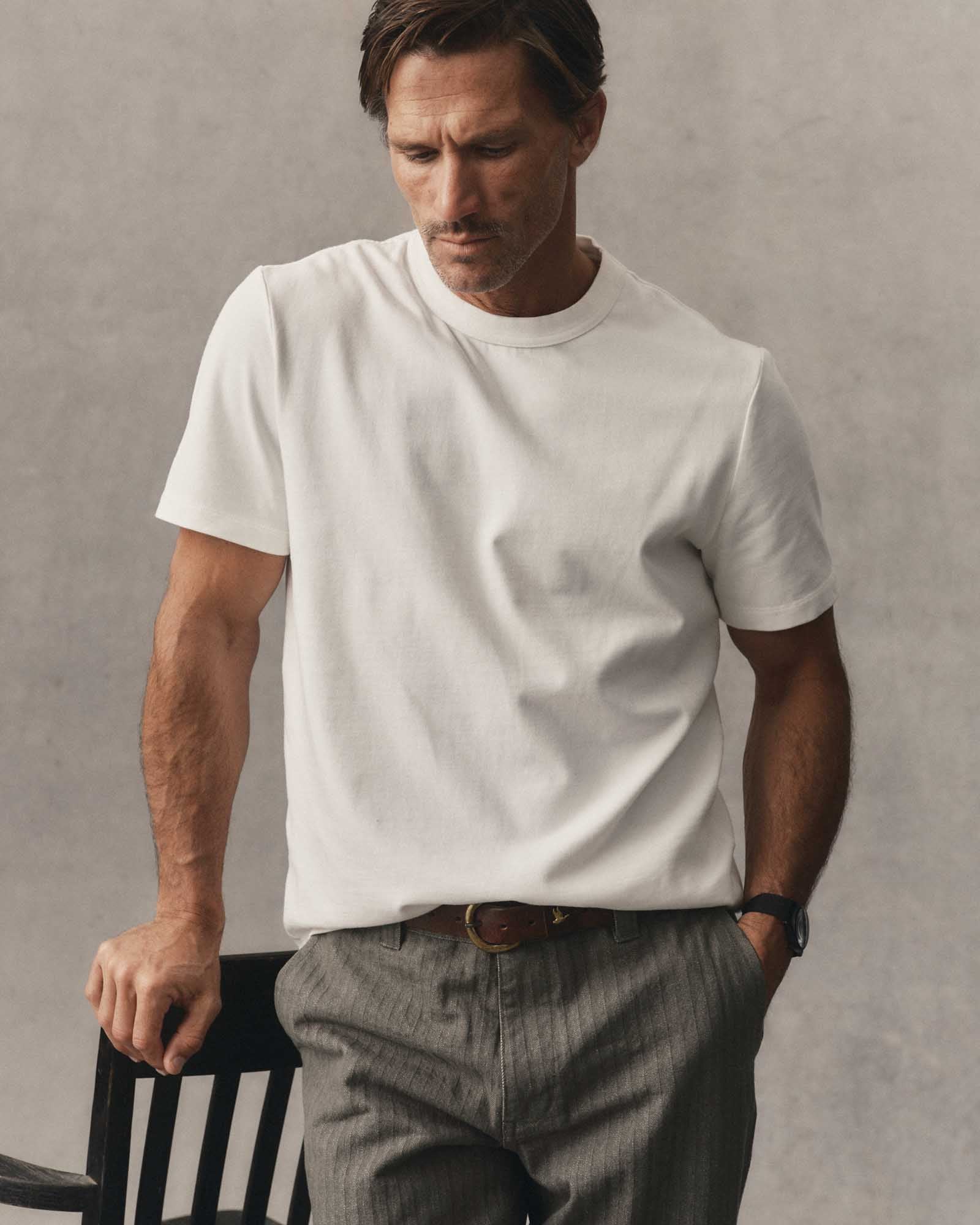fit model posing in The Organic Cotton Shop Tee in White, Knits by Taylor Stitch